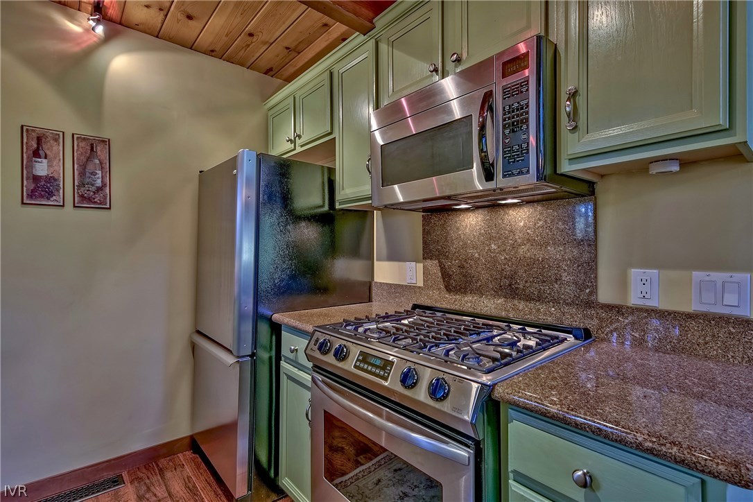 973 Apollo Way Incline Village, NV 89451 - Photo 13 of 35 a kitchen with a stove and a microwave