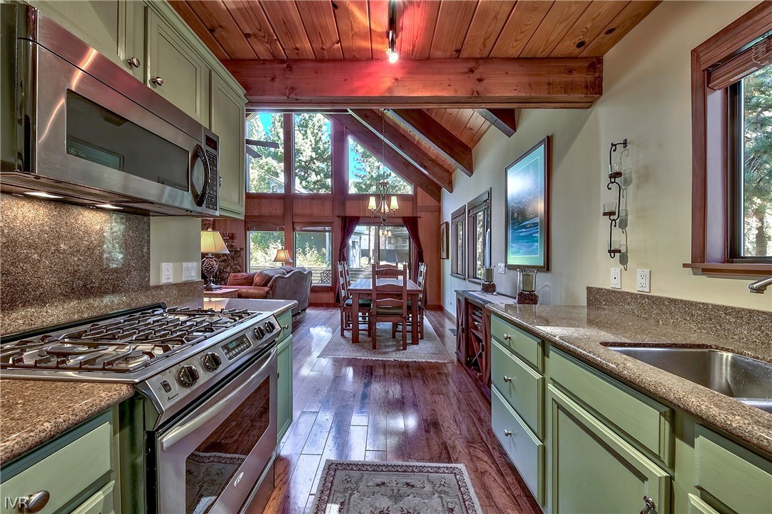 973 Apollo Way Incline Village, NV 89451 - Photo 15 of 35 a kitchen with wooden cabinets stove and sink
