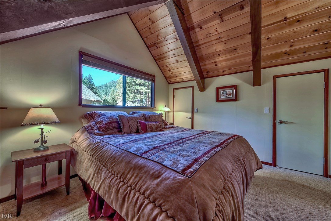 973 Apollo Way Incline Village, NV 89451 - Photo 22 of 35 a bed sitting in a bedroom next to a window