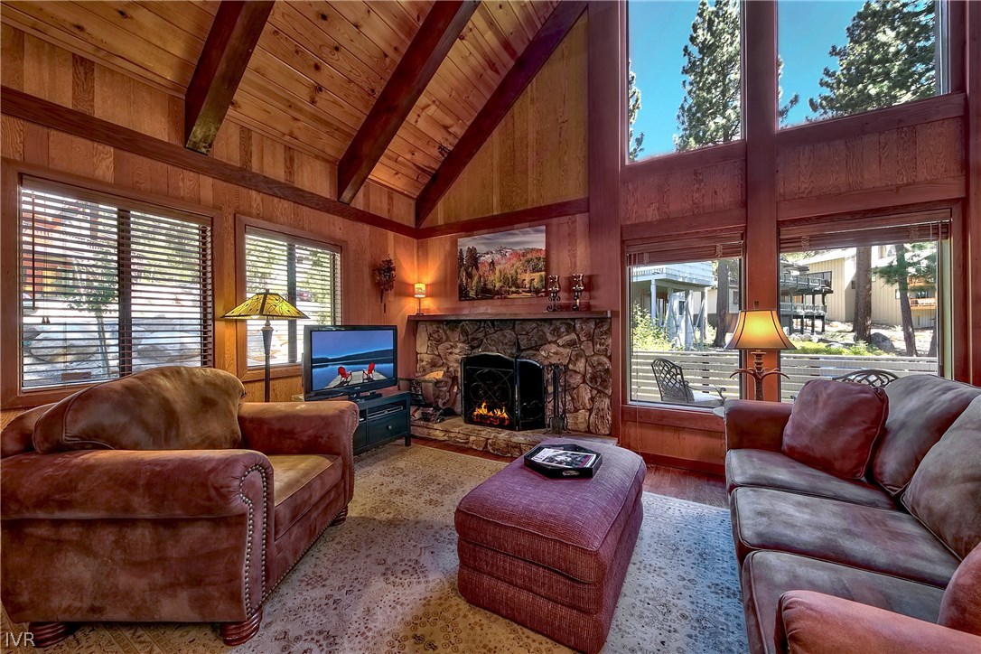 973 Apollo Way Incline Village, NV 89451 - Photo 9 of 35 a living room with furniture a fireplace and a large window