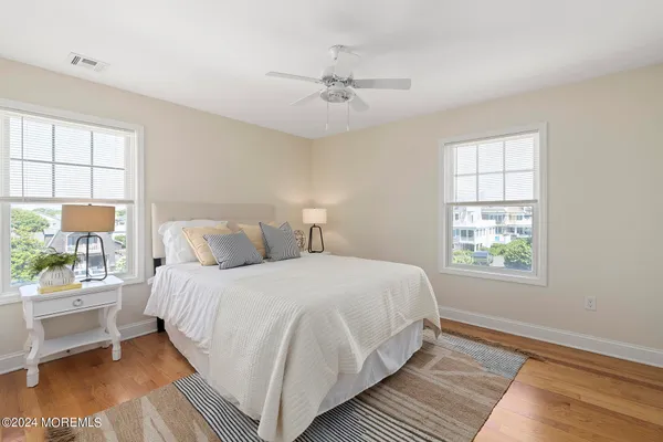 a bedroom with bed and a window
