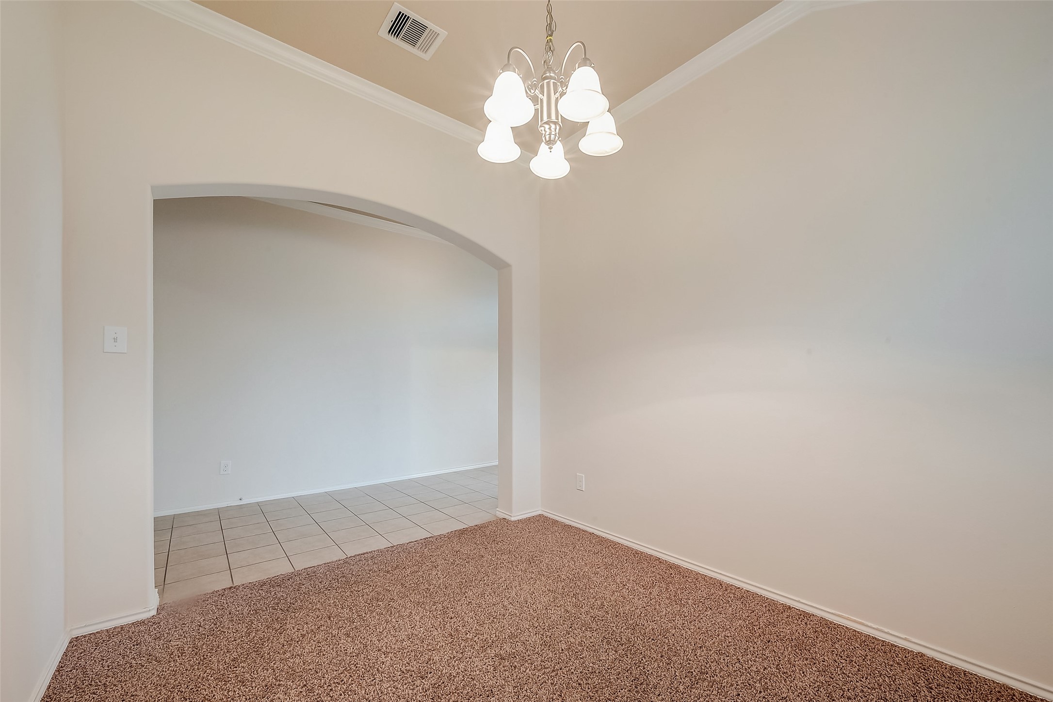 21203 Branchport Drive Houston, TX 77095 - Photo 14 of 49 a view of a chandelier fan and fire place