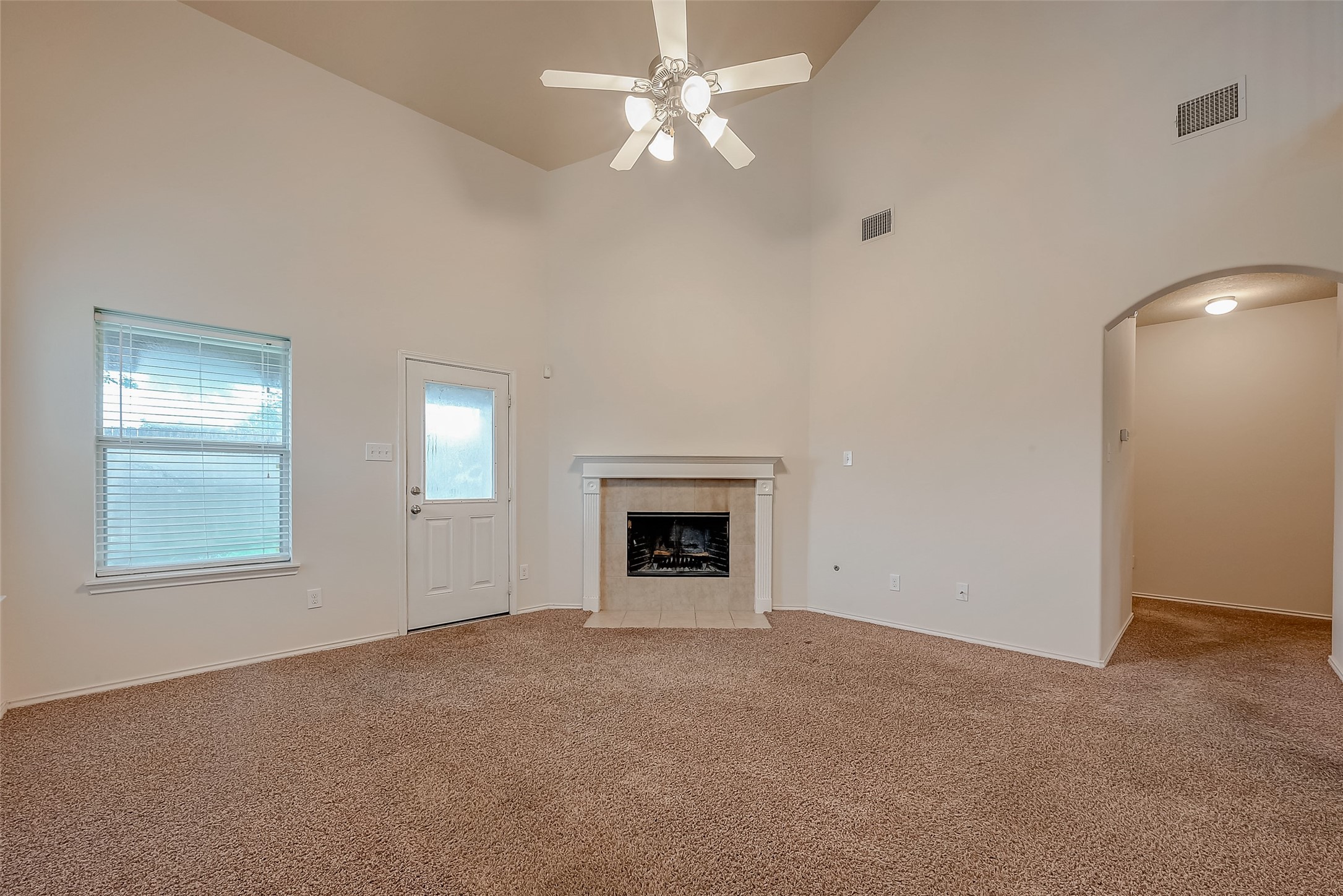 21203 Branchport Drive Houston, TX 77095 - Photo 15 of 49 an empty room with windows and fireplace