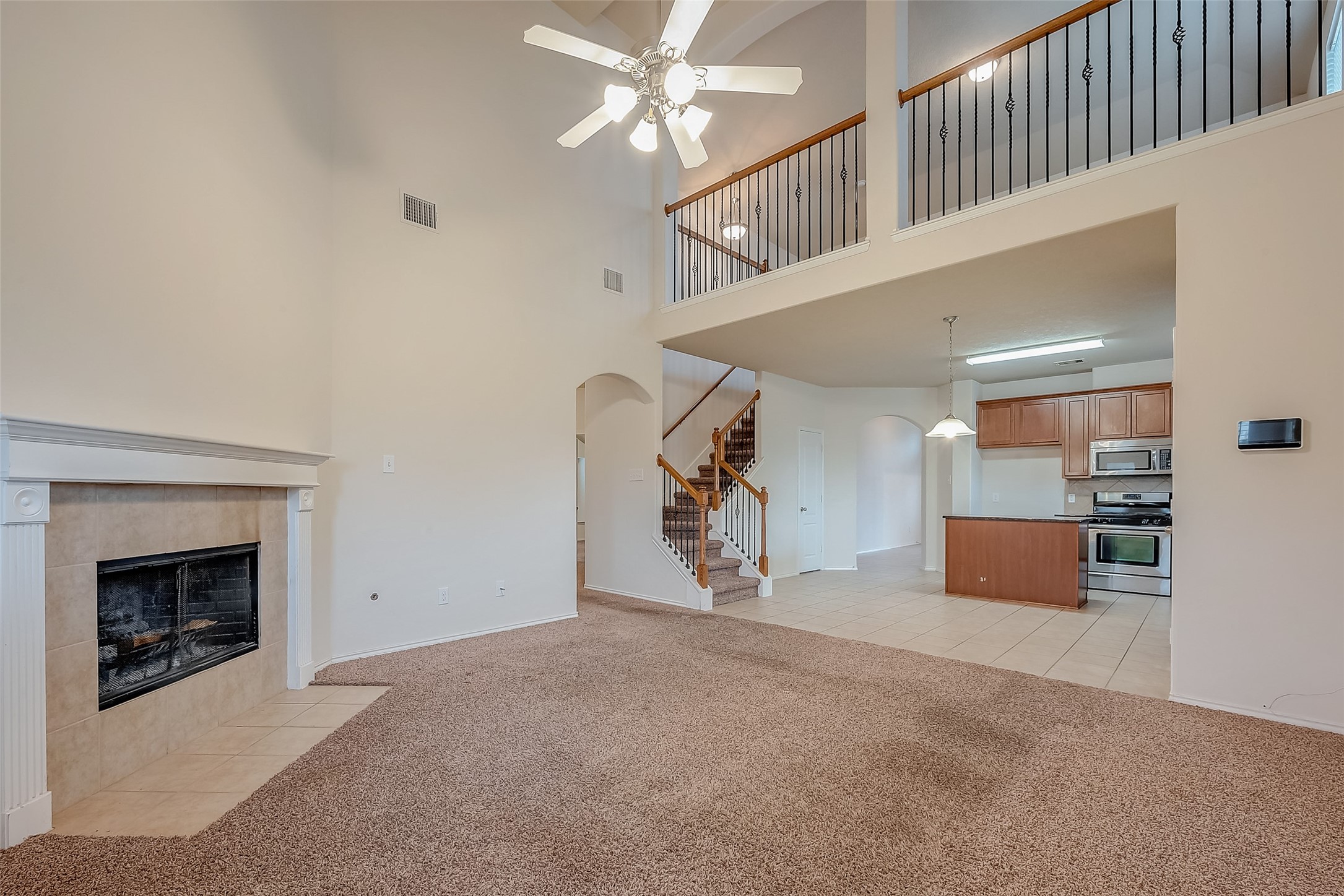 21203 Branchport Drive Houston, TX 77095 - Photo 16 of 49 a view of a livingroom with a staircase