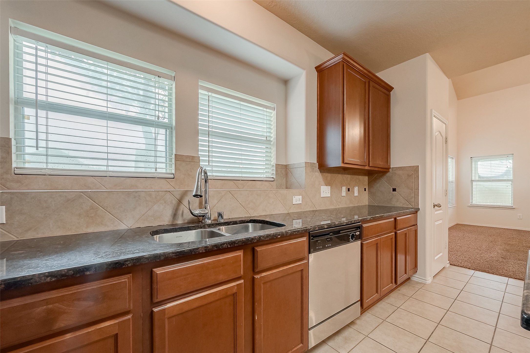 21203 Branchport Drive Houston, TX 77095 - Photo 21 of 49 a kitchen with stainless steel appliances granite countertop a sink and a stove
