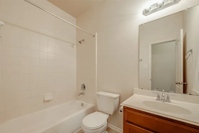 a bathroom with a sink vanity and a mirror