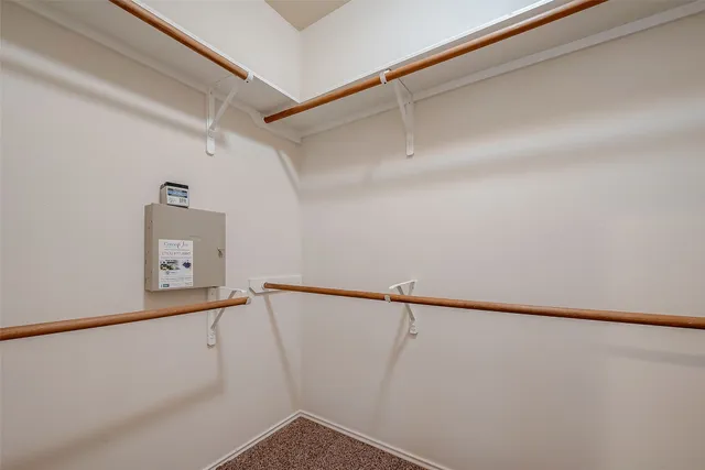 a bathroom with a tub a sink and mirror