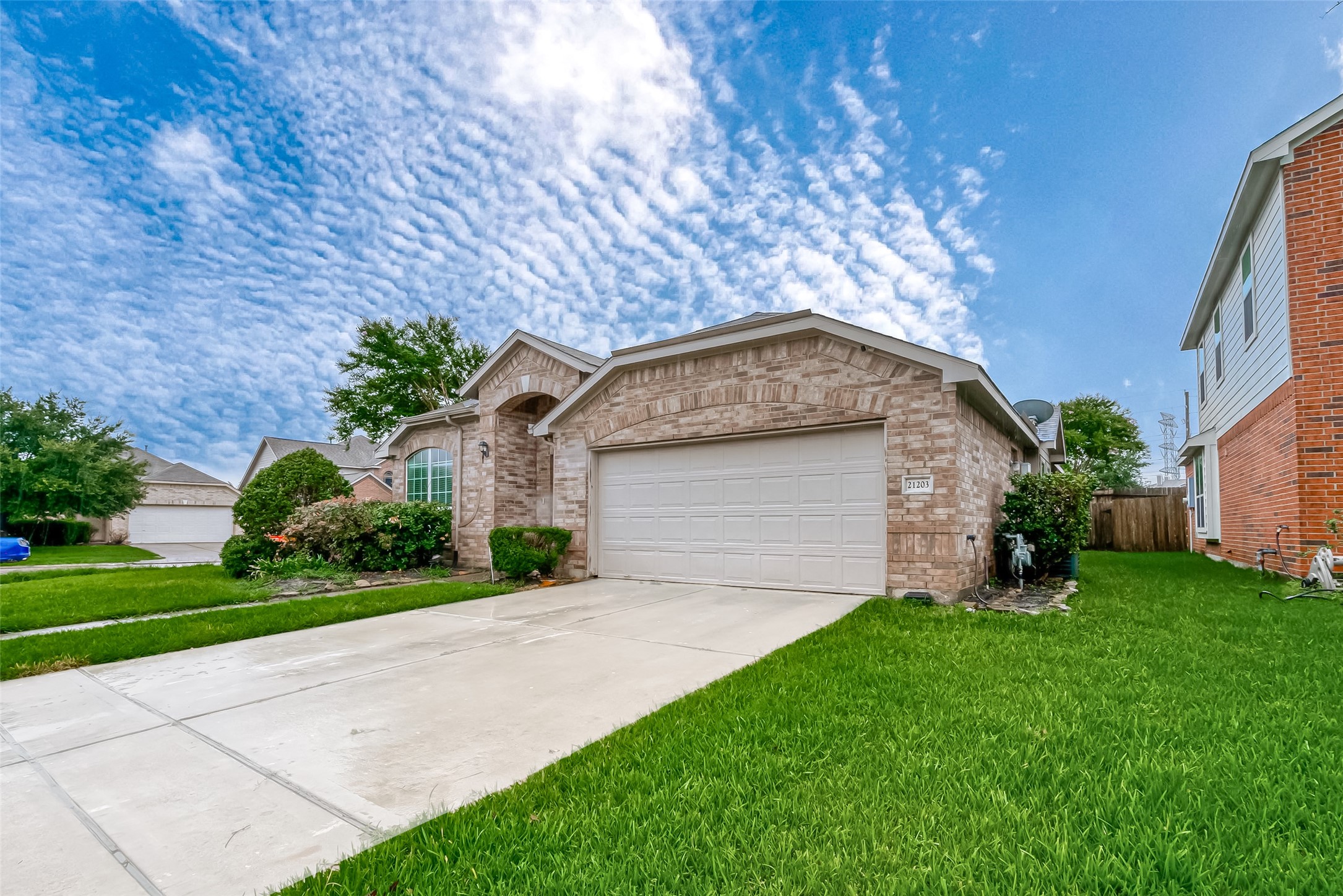 21203 Branchport Drive Houston, TX 77095 - Photo 4 of 49 a front view of a house with a yard and garage