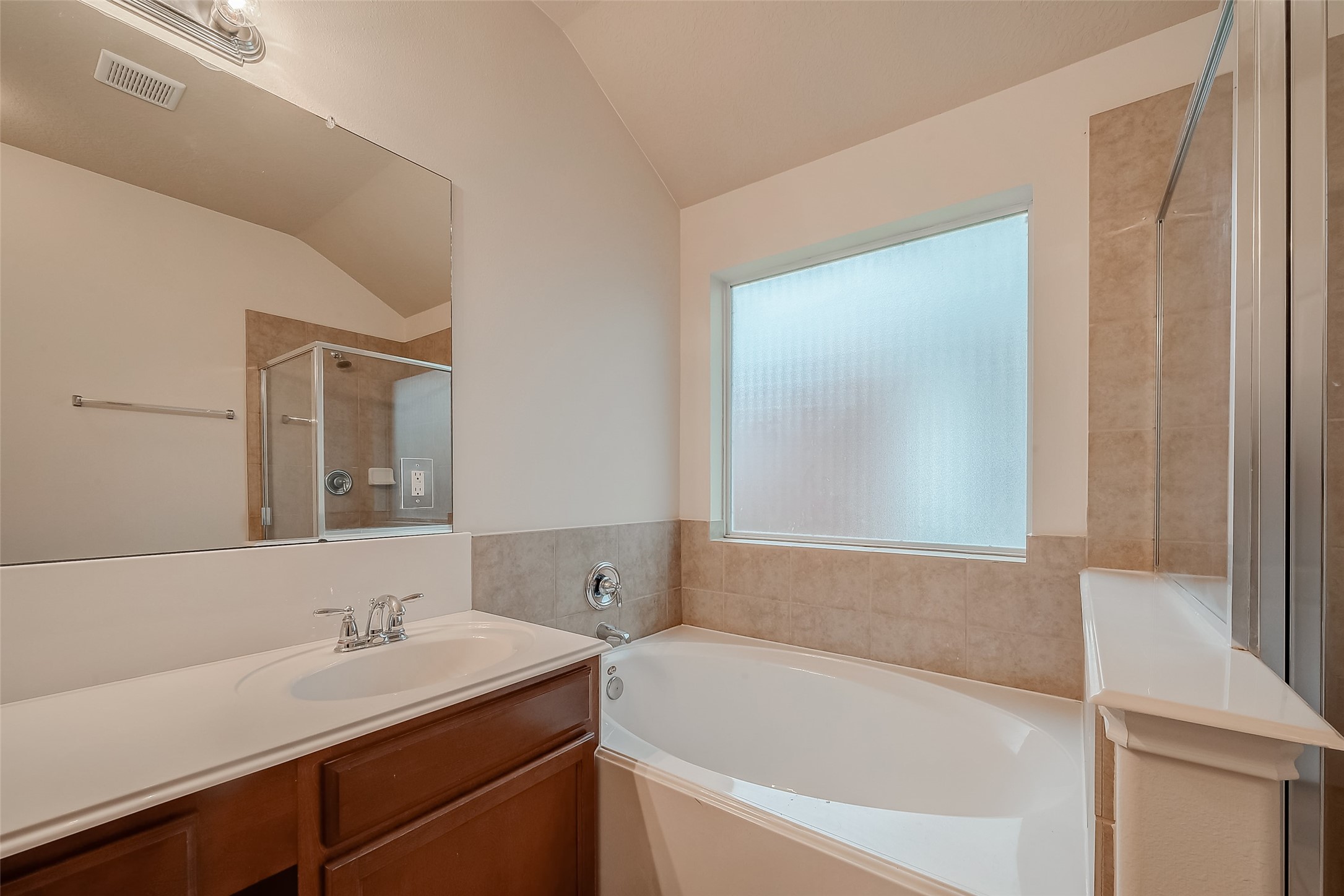 21203 Branchport Drive Houston, TX 77095 - Photo 43 of 49 a bathroom with a tub sink and mirror