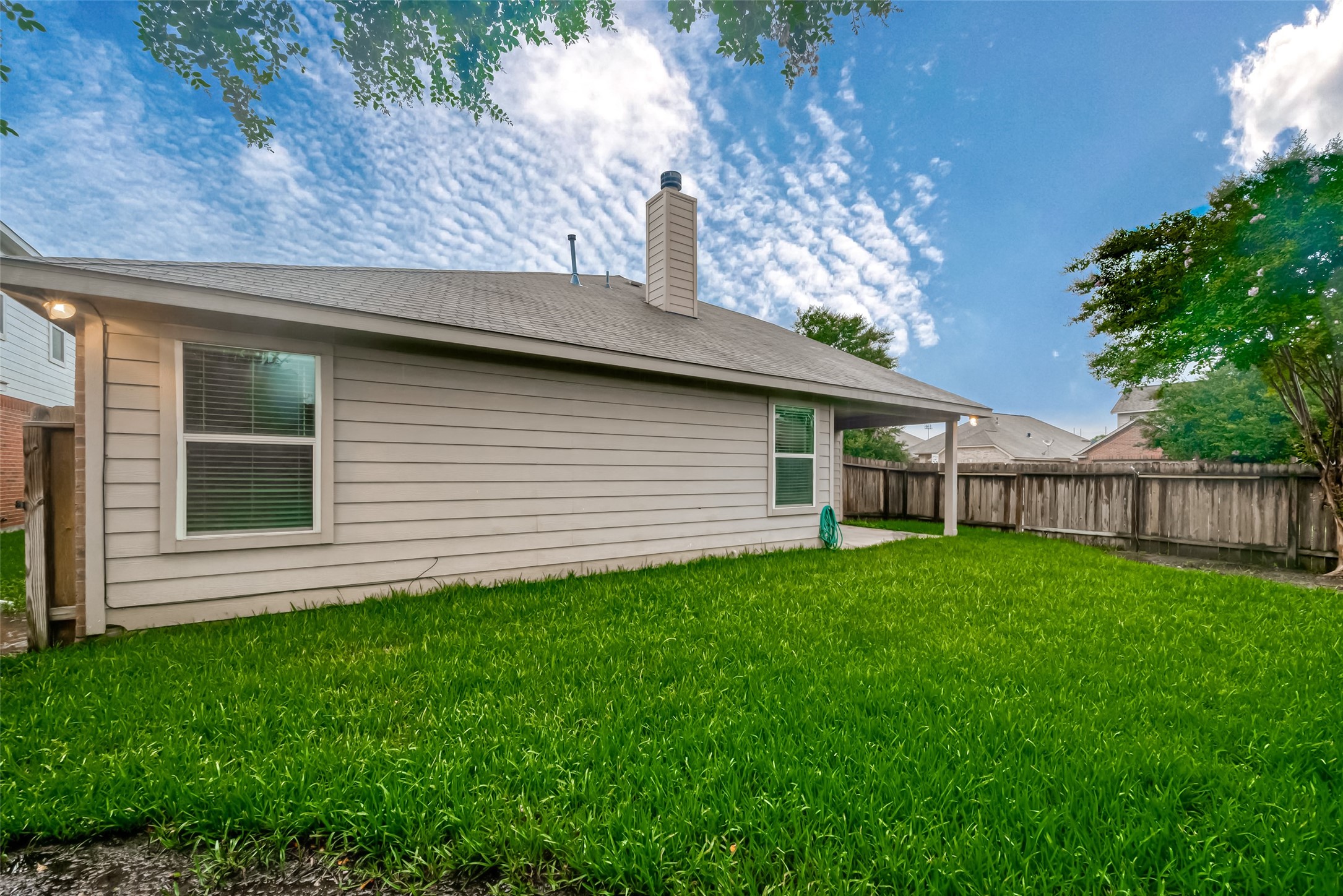 21203 Branchport Drive Houston, TX 77095 - Photo 49 of 49 a backyard of a house with lots of green space