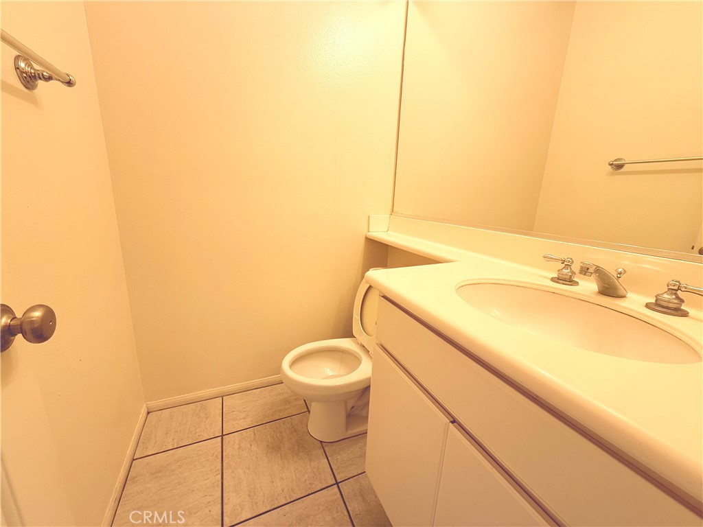 8 Marsala Irvine, CA 92606 - Photo 5 of 11 a bathroom with a granite countertop sink and a mirror