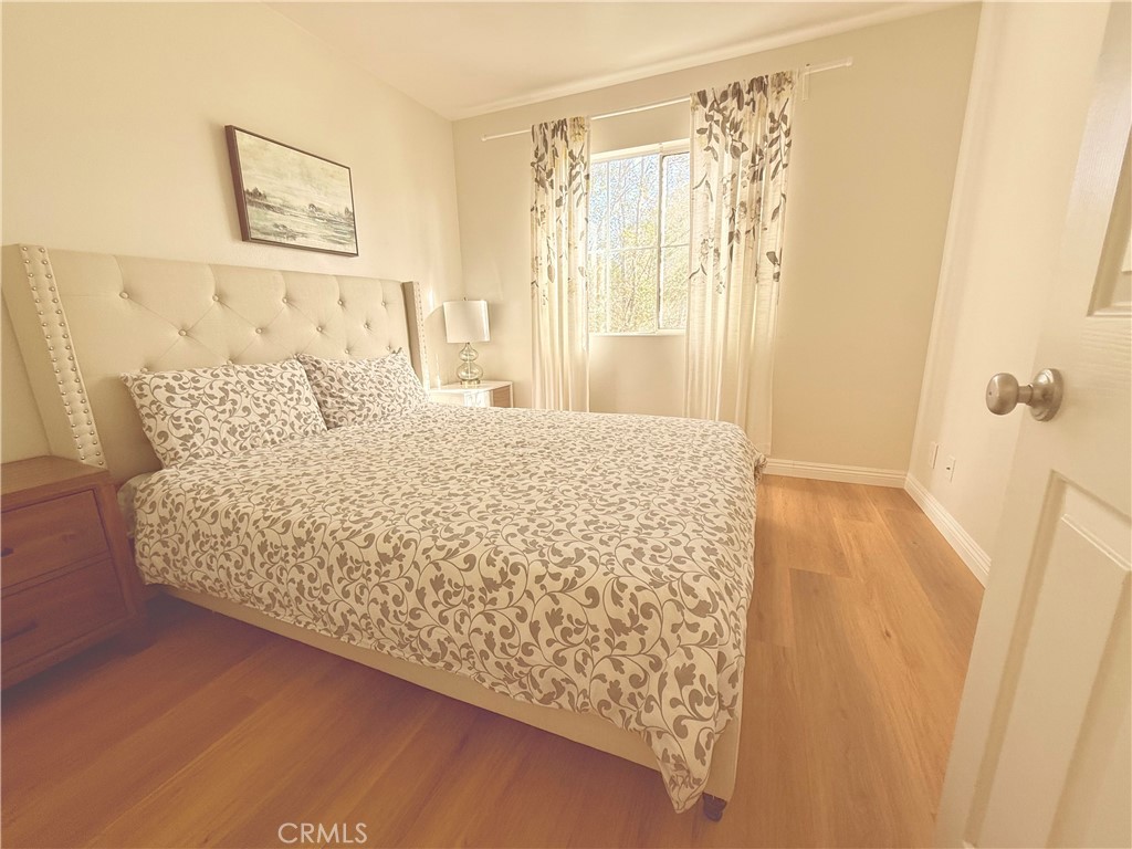 8 Marsala Irvine, CA 92606 - Photo 6 of 11 a large bed sitting in a bedroom next to a bathroom