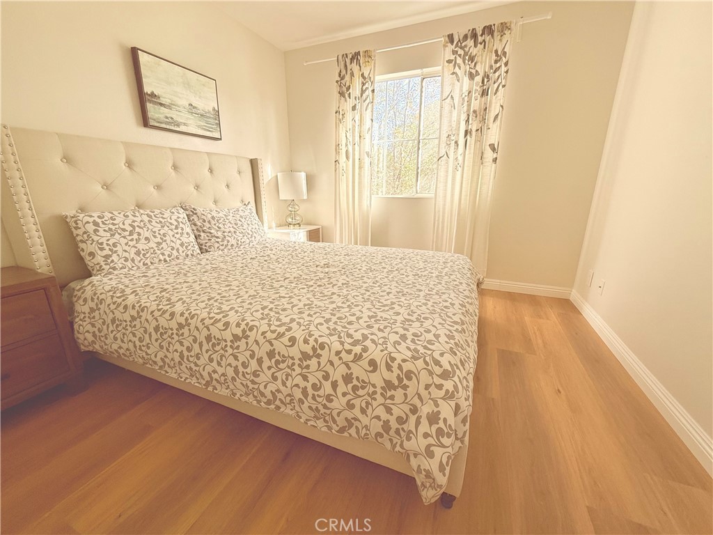 8 Marsala Irvine, CA 92606 - Photo 8 of 11 a large bed sitting in a bedroom next to a window