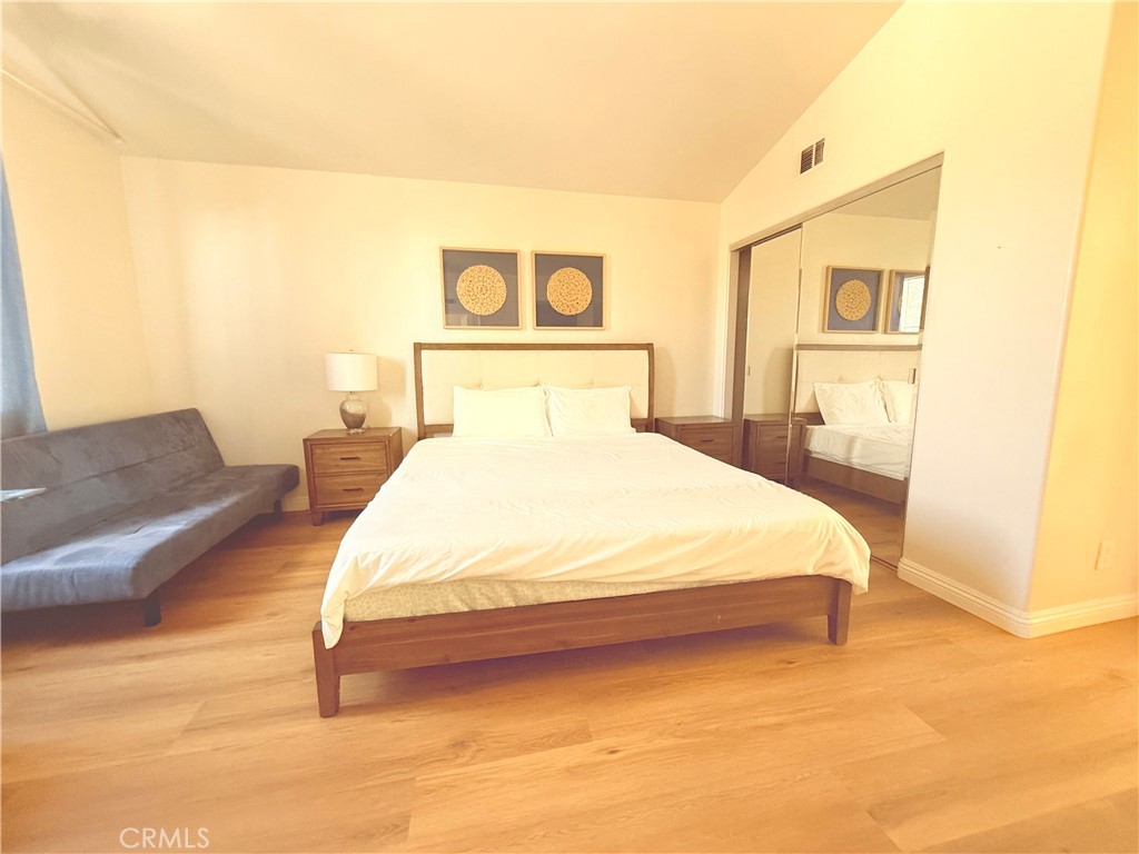 8 Marsala Irvine, CA 92606 - Photo 10 of 11 a bedroom with a bed painting on wall and a potted plant