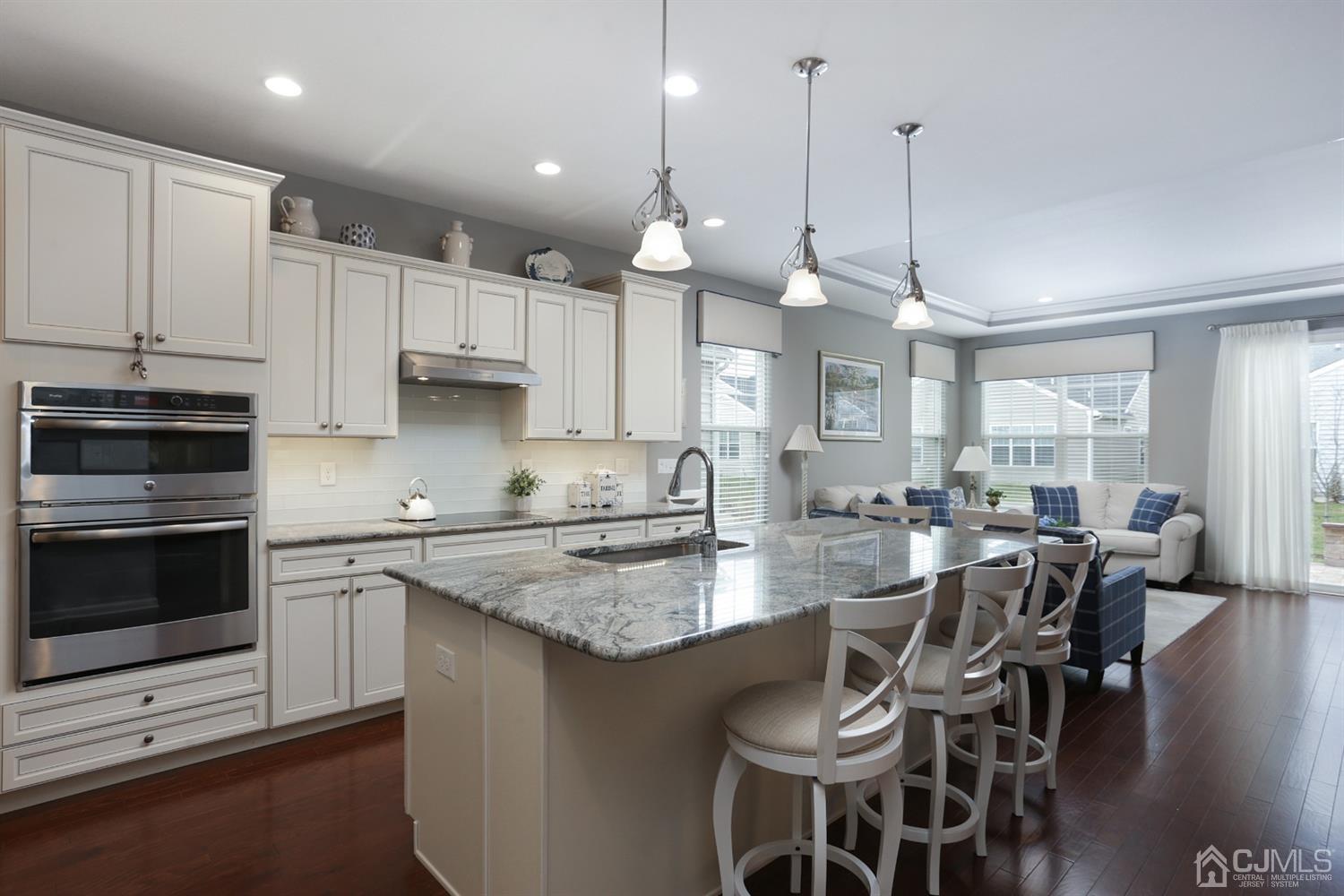 28 Harvest Ridge Road Howell, NJ 07731 - Photo 8 of 27 The upgraded gourmet kitchen has granite countertops, stainless steel appliances, and large center island.