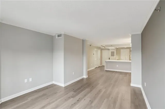 a kitchen with kitchen island a sink stainless steel appliances and cabinets