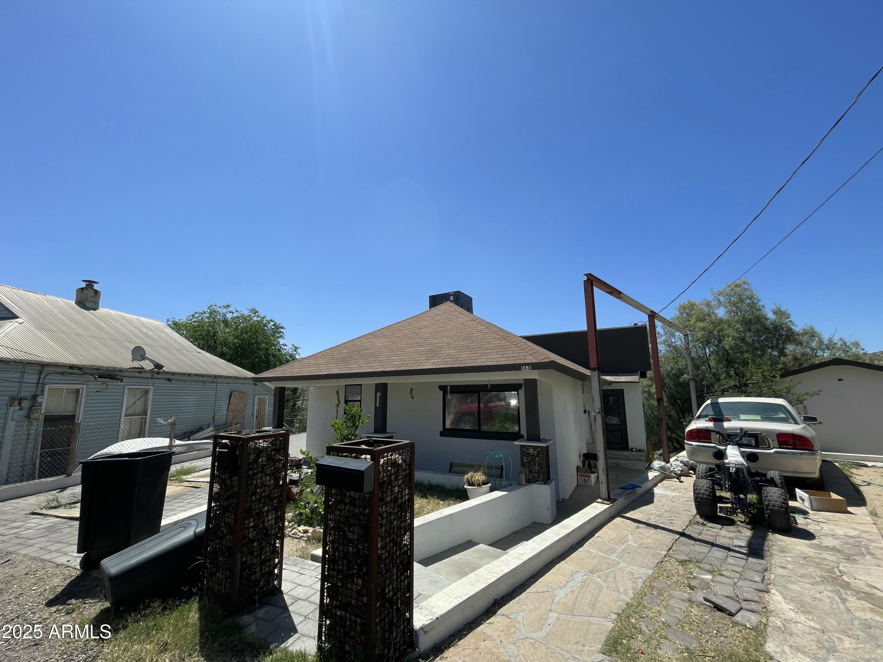 168 Cedar Avenue Miami, AZ 85539 - Photo 10 of 10 a car parked in front of house