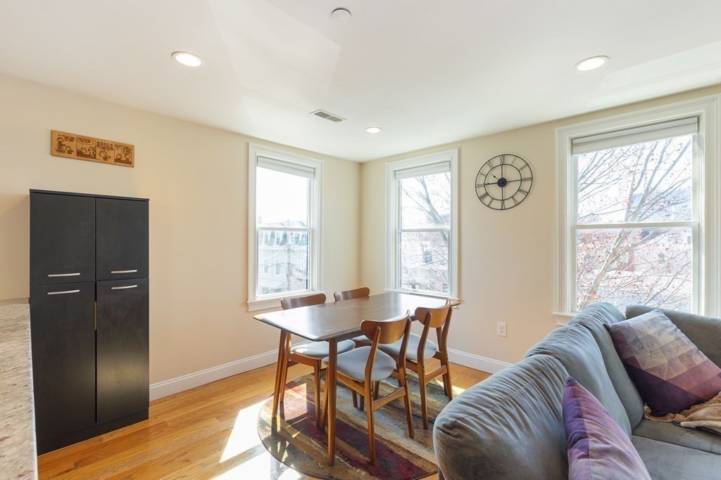 129 Spring Street, Unit 3 Cambridge, MA 02141 - Photo 7 of 17 a living room with furniture and a window