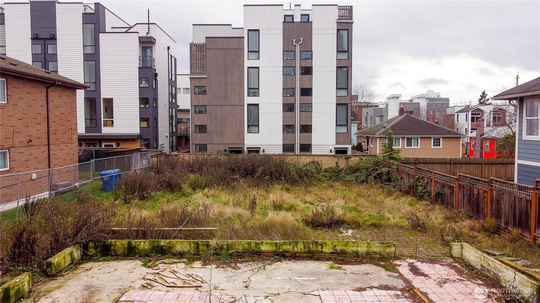 a view of a blue building with swimming pool in front of it