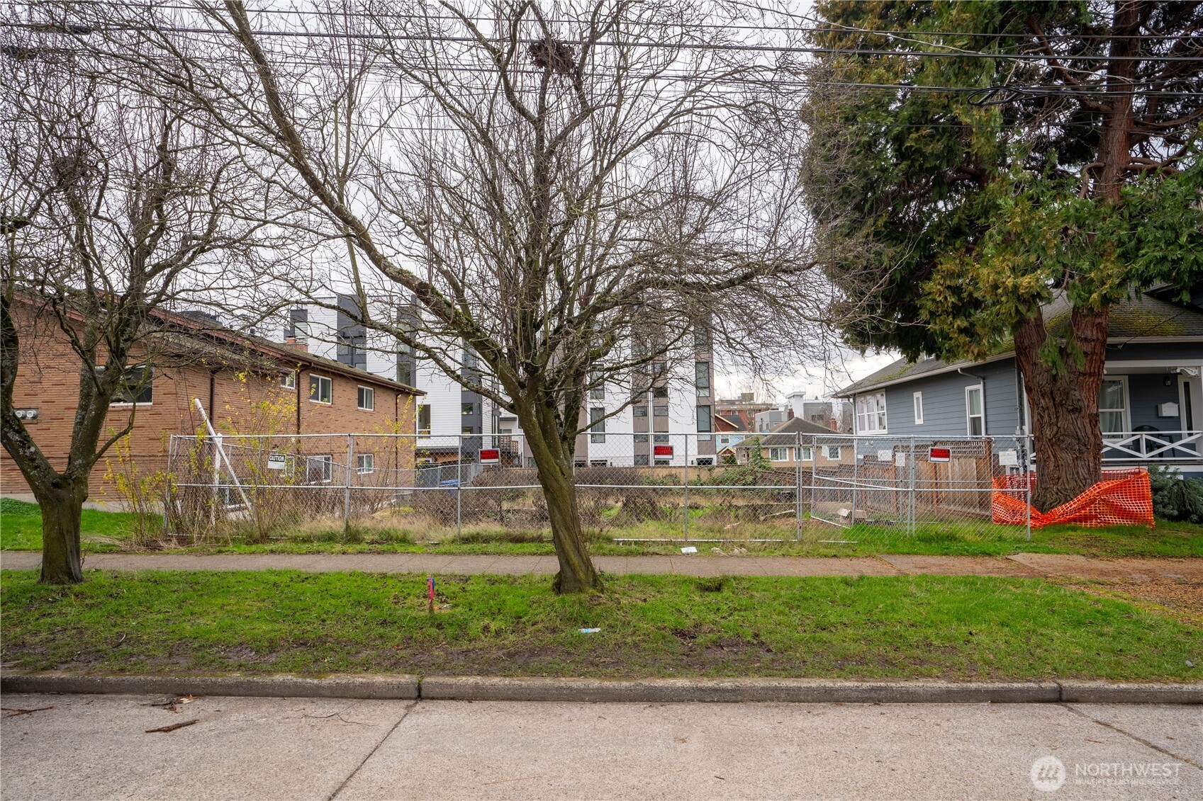 927 Northwest 57th Street Seattle, WA 98107 - Photo 9 of 12 a front view of a house with a yard table and chairs
