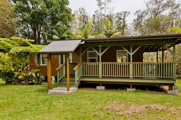 a view of a chair and table in the garden