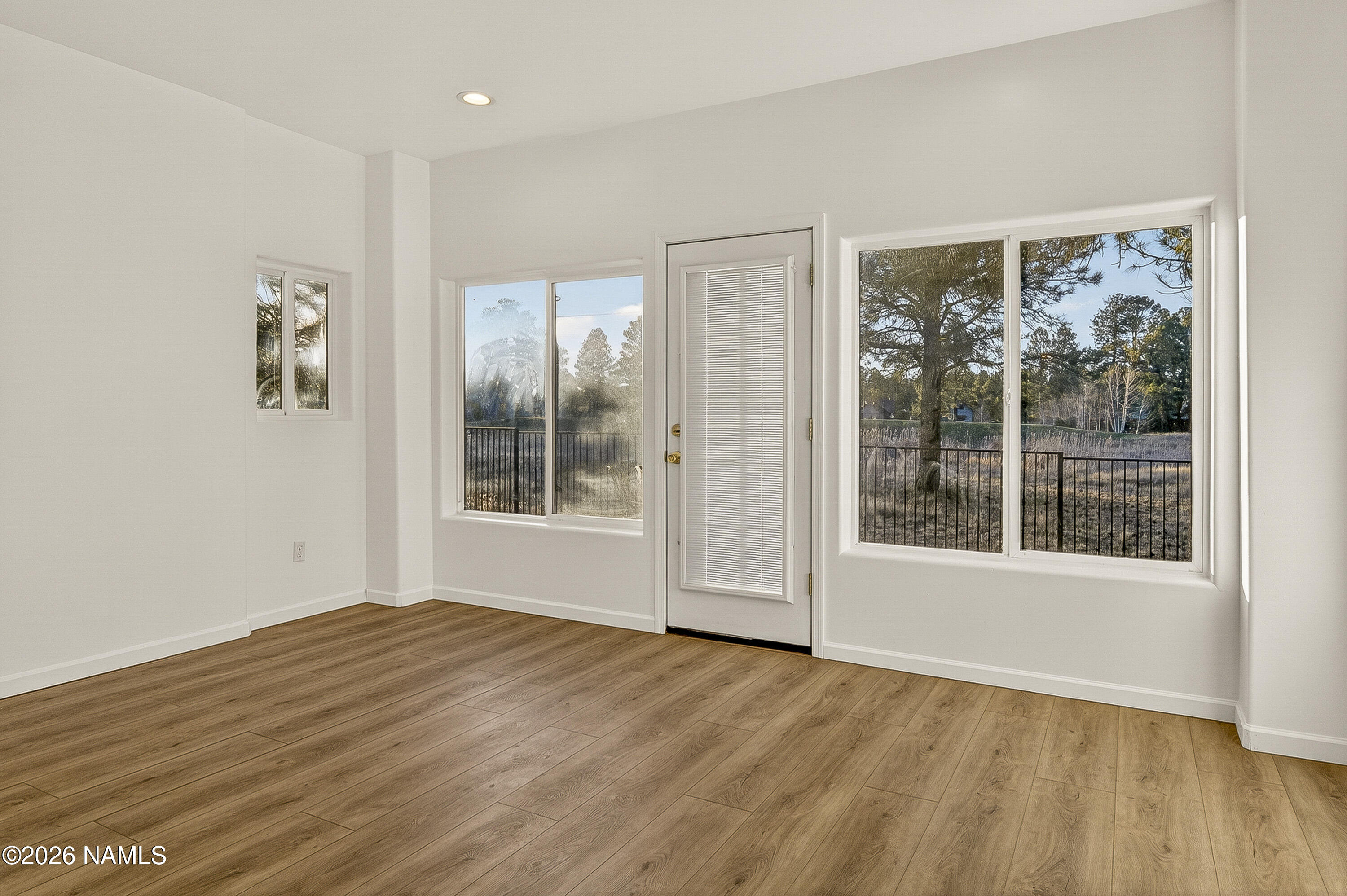 600 Brookline Loop Williams, AZ 86046 - Photo 20 of 43 a view of empty room with wooden floor and fan