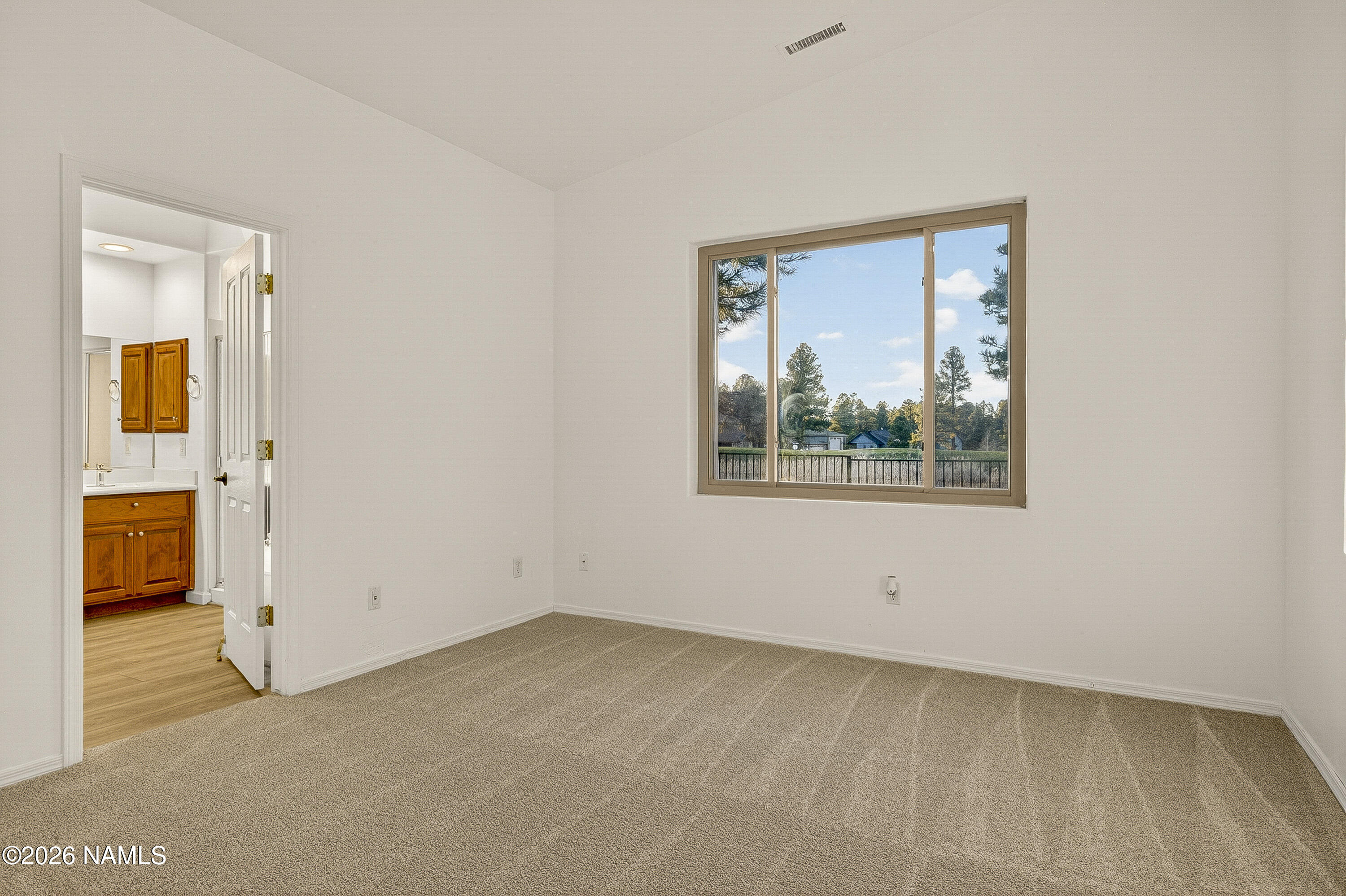 600 Brookline Loop Williams, AZ 86046 - Photo 22 of 43 an empty room with a window