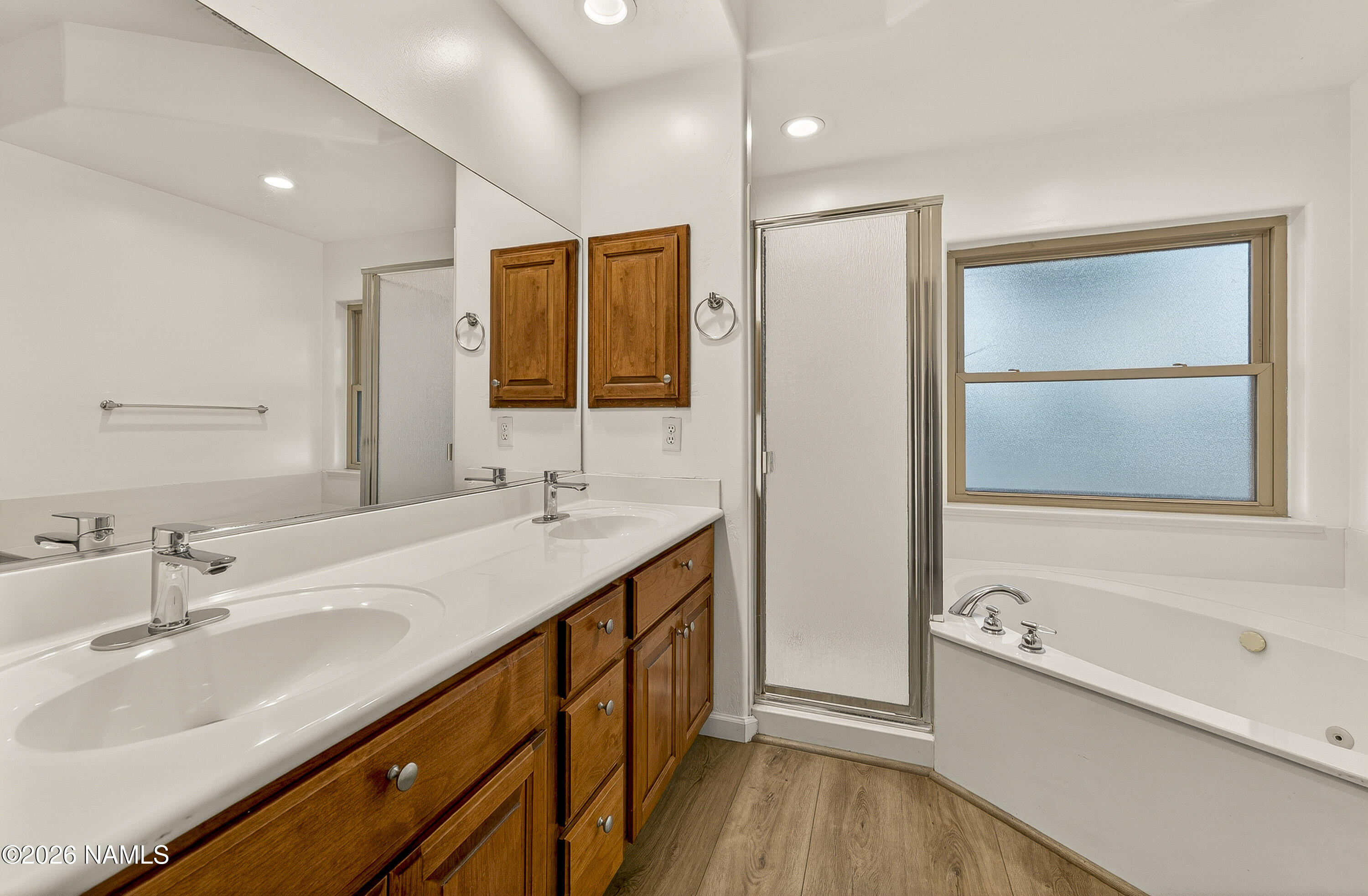 600 Brookline Loop Williams, AZ 86046 - Photo 25 of 43 a bathroom with a tub sink and mirror
