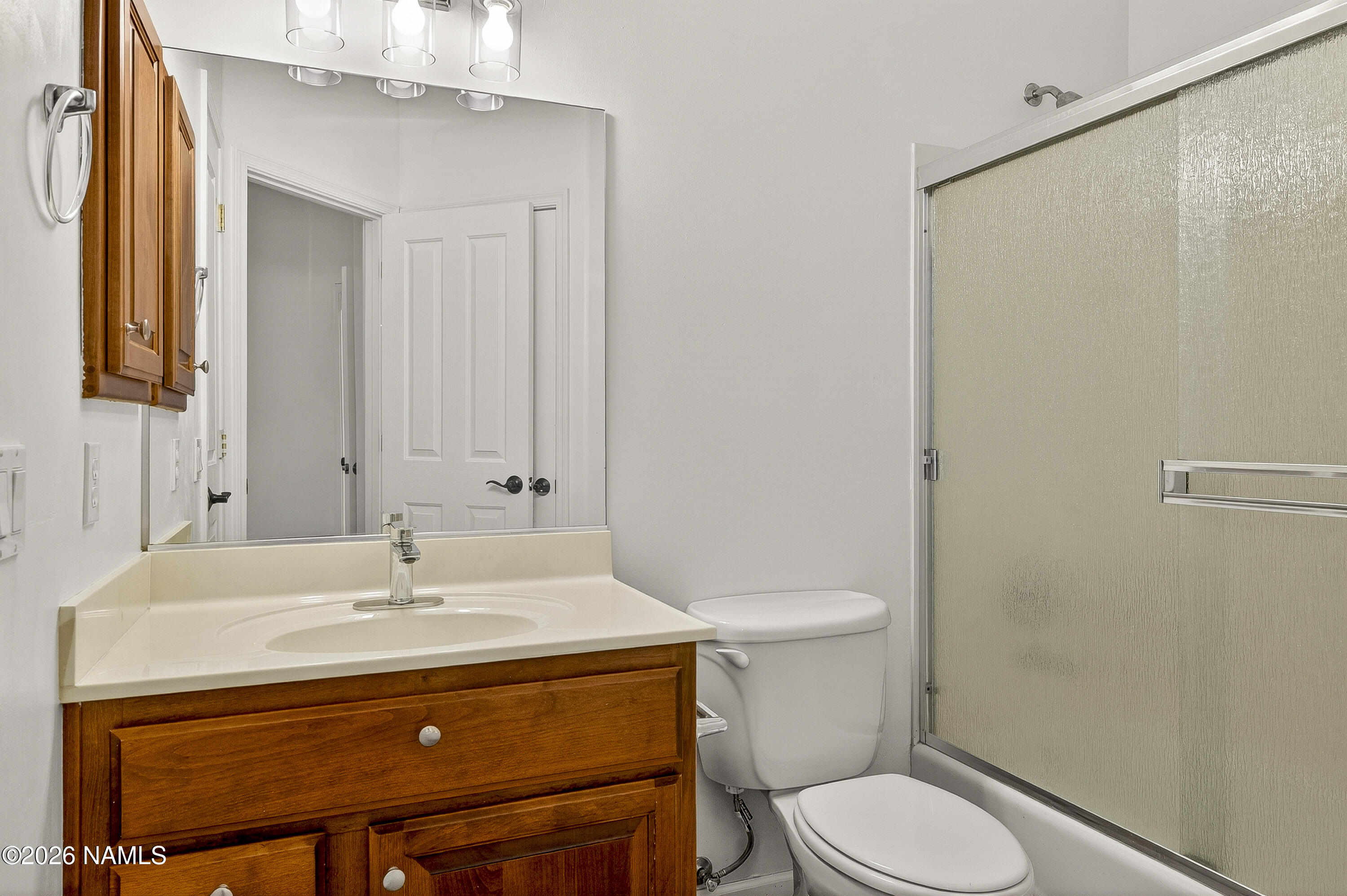 600 Brookline Loop Williams, AZ 86046 - Photo 31 of 43 a bathroom with a sink a toilet and mirror