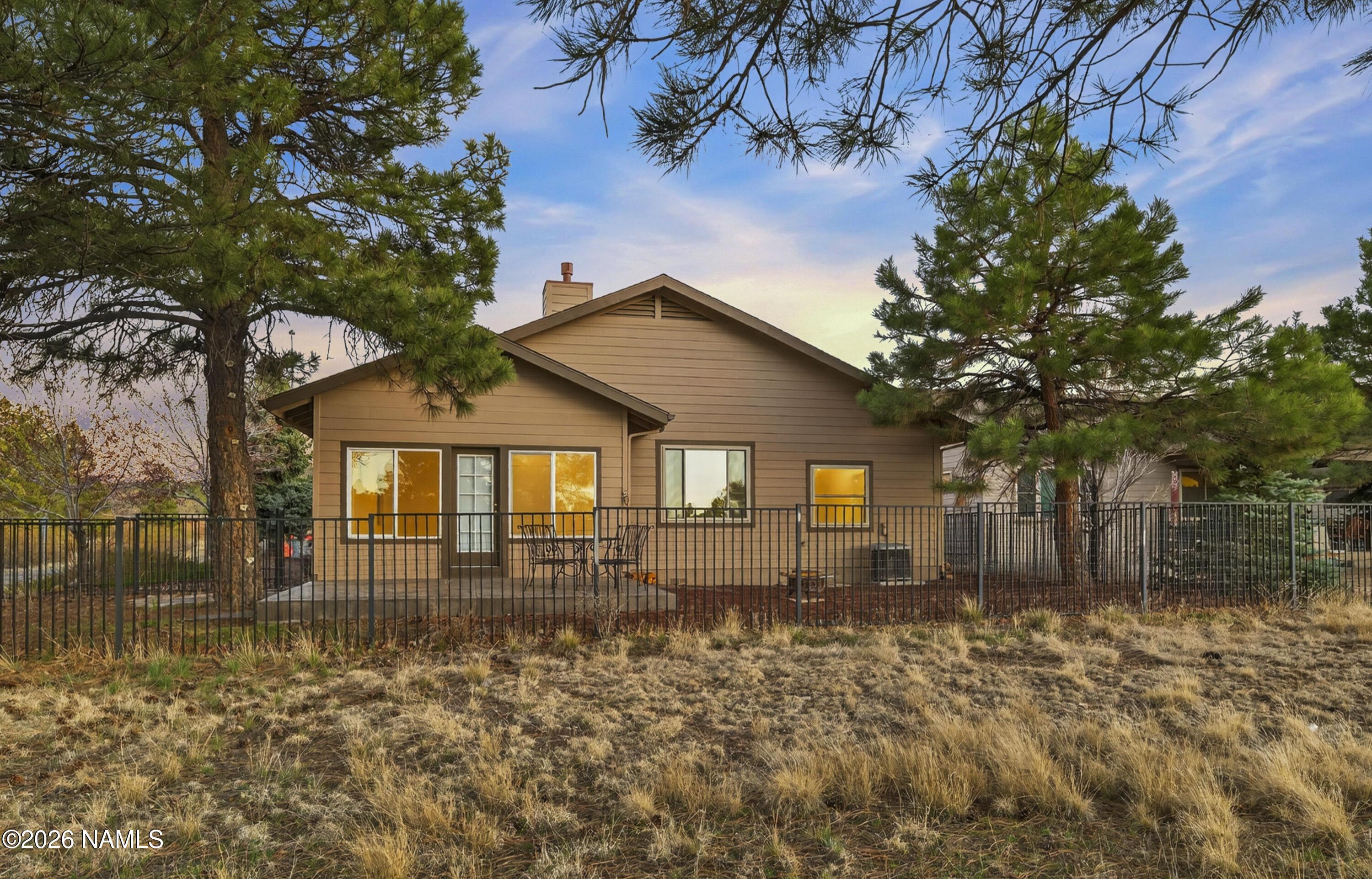 600 Brookline Loop Williams, AZ 86046 - Photo 4 of 43 a front view of a house with a yard