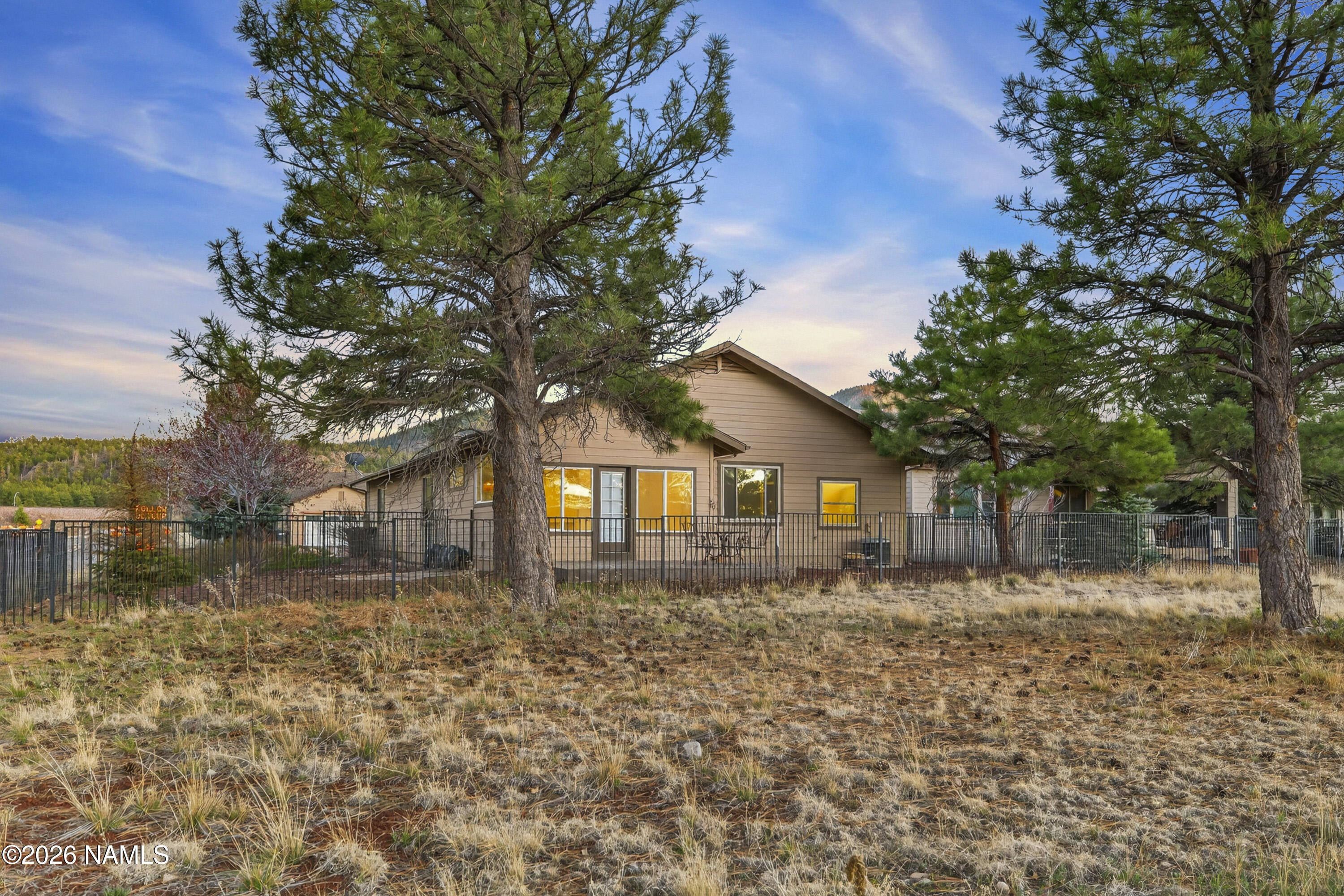 600 Brookline Loop Williams, AZ 86046 - Photo 5 of 43 a front view of a house with a yard
