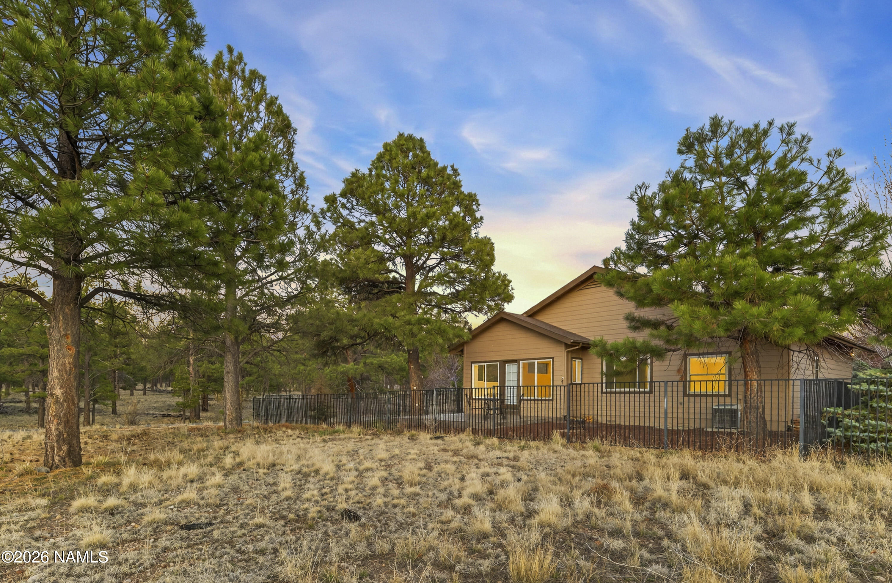 600 Brookline Loop Williams, AZ 86046 - Photo 6 of 43 a front view of a house with a yard