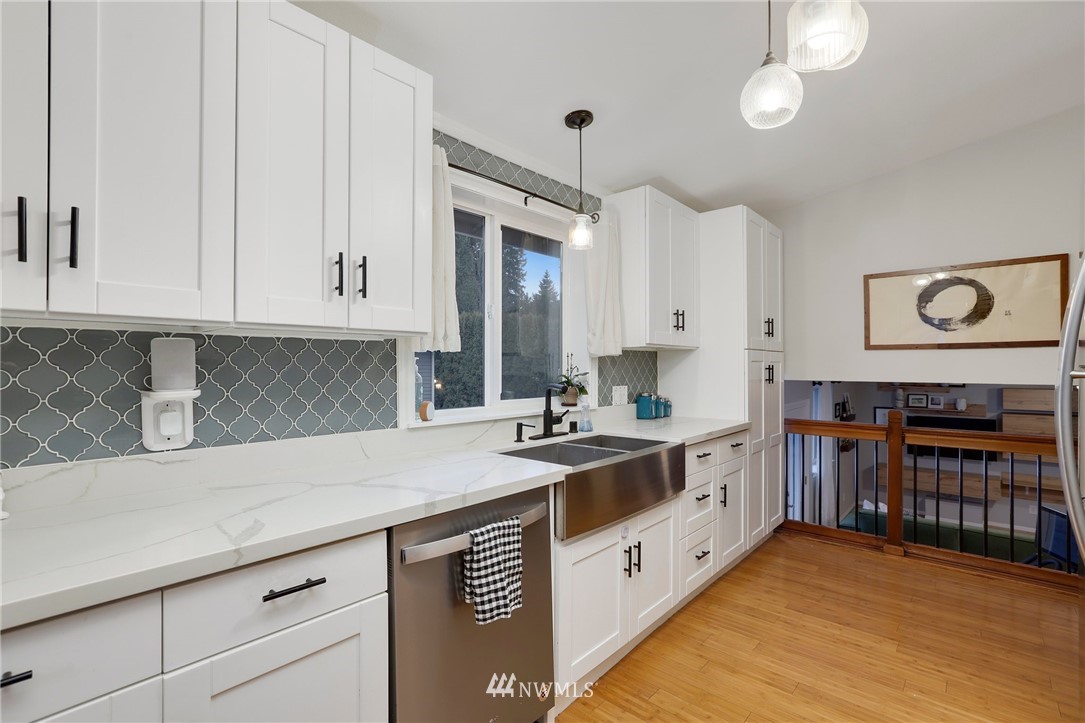 1701 174th Place Southeast Bothell, WA 98012 - Photo 14 of 40 a kitchen with stainless steel appliances granite countertop a sink and cabinets