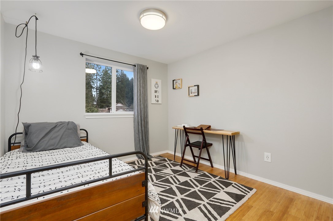 1701 174th Place Southeast Bothell, WA 98012 - Photo 24 of 40 a bedroom with a bed and a window
