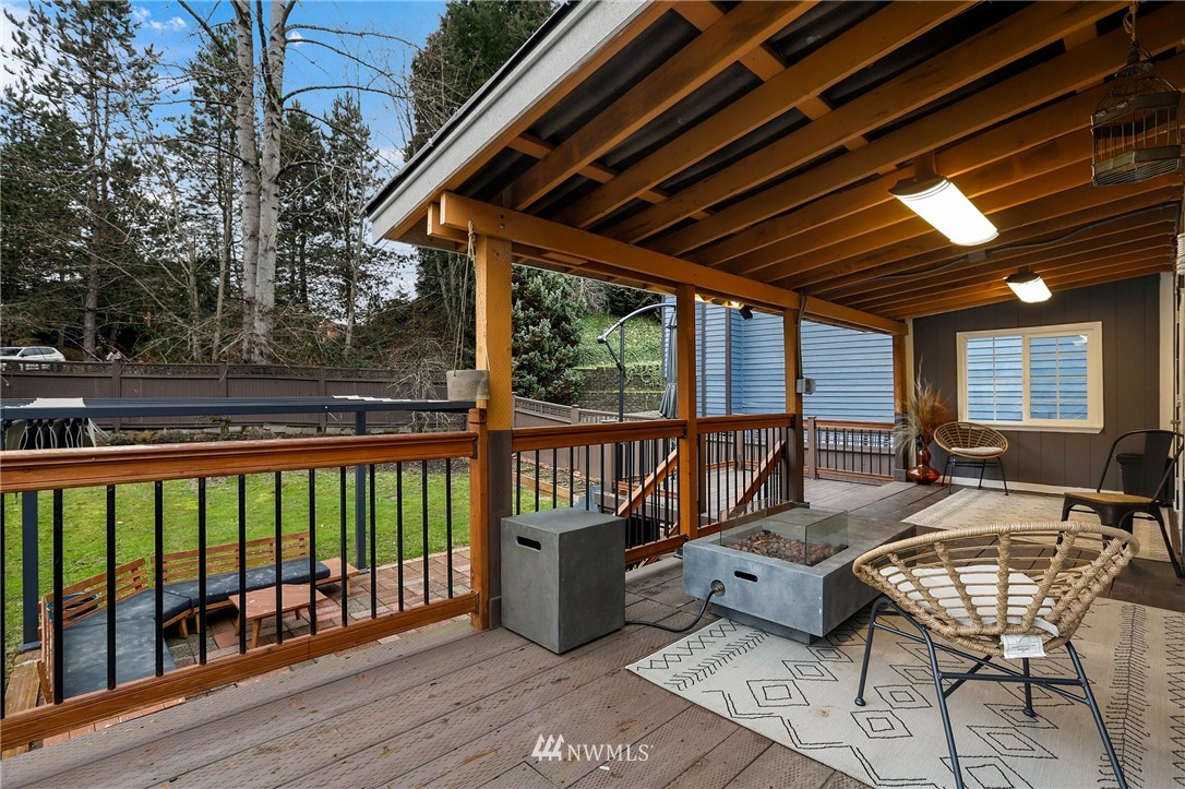 1701 174th Place Southeast Bothell, WA 98012 - Photo 28 of 40 a view of a balcony with chairs and wooden floor