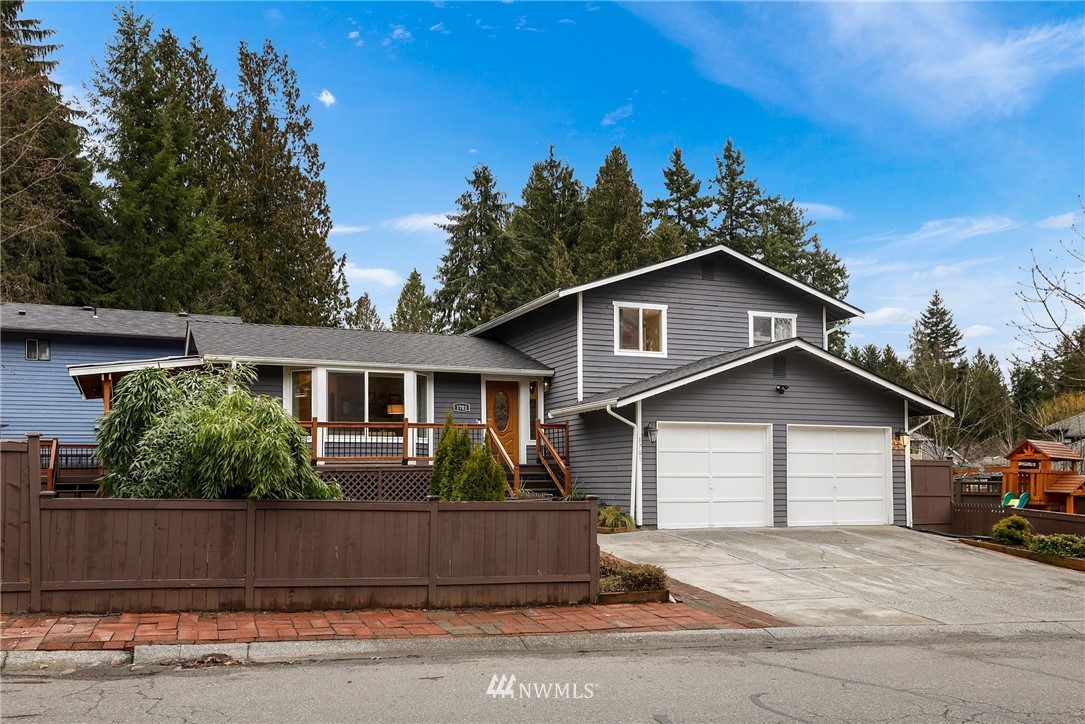 1701 174th Place Southeast Bothell, WA 98012 - Photo 3 of 40 a front view of a house with a garden