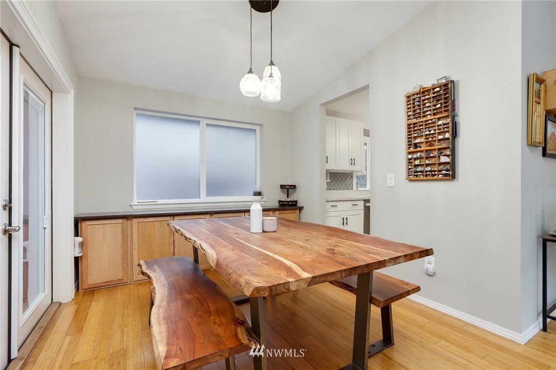 1701 174th Place Southeast Bothell, WA 98012 - Photo 9 of 40 a view of a dining room with furniture and wooden floor