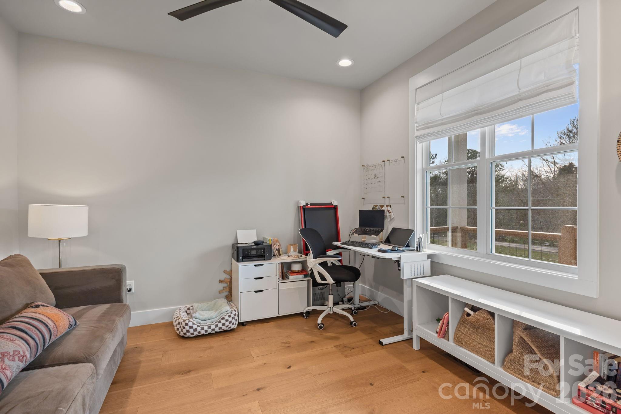 234 Gravely Branch Road Fletcher, NC 28732 - Photo 18 of 46 a view of a workspace with furniture and a window