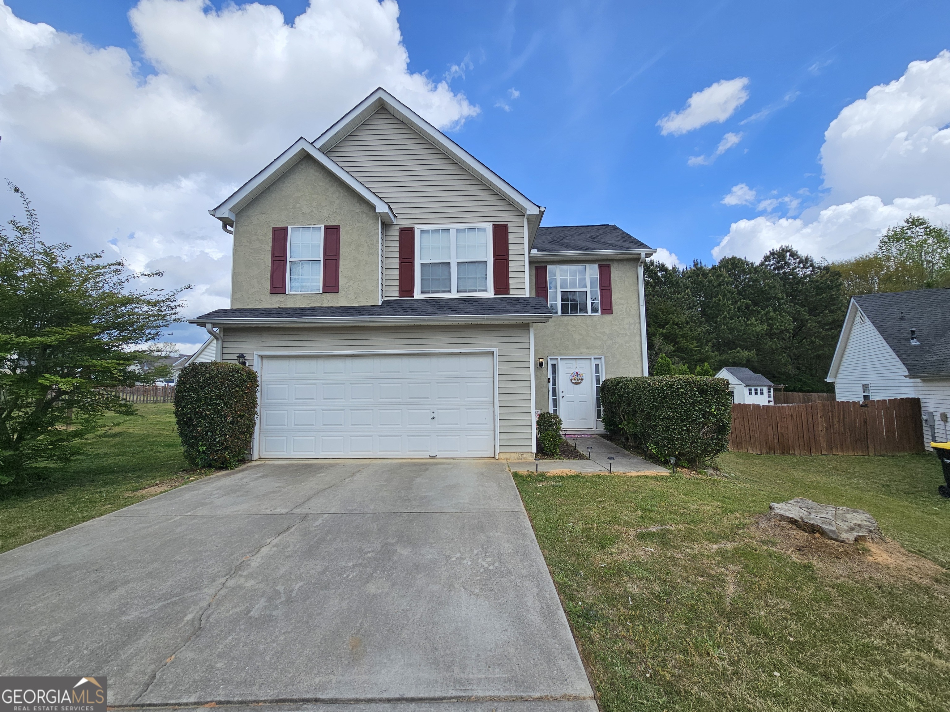 5077 Meadow Trace Fairburn, GA 30213 - Photo 1 of 43 a view of a house with yard and a garage