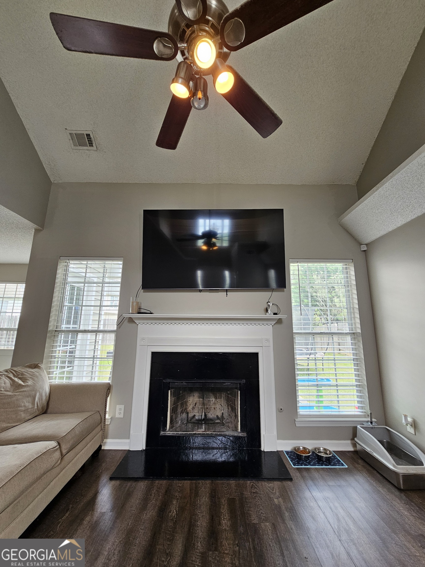 5077 Meadow Trace Fairburn, GA 30213 - Photo 20 of 43 a living room with furniture and a fireplace