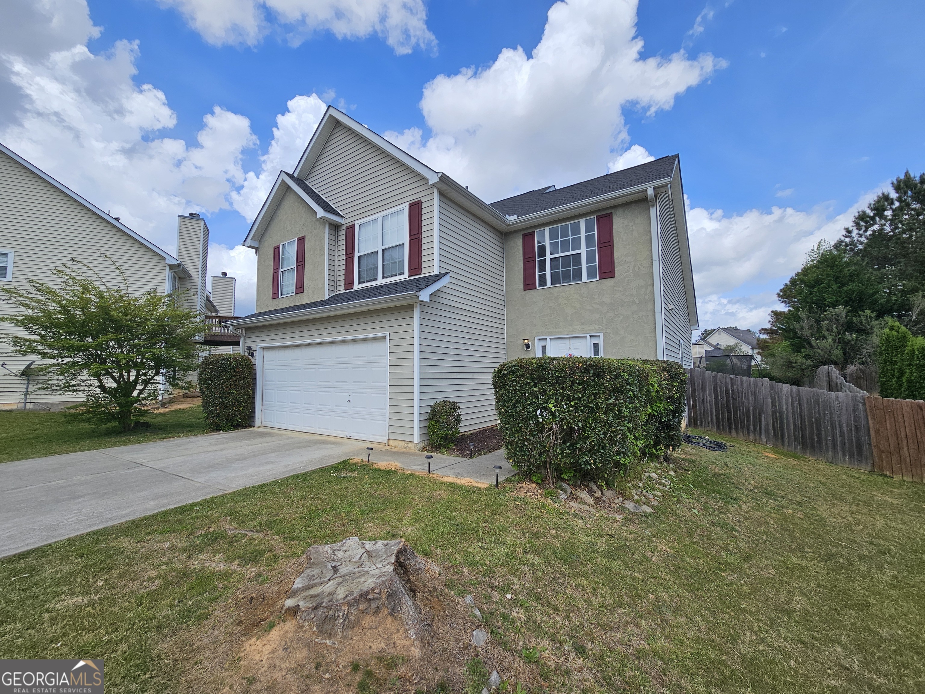 5077 Meadow Trace Fairburn, GA 30213 - Photo 3 of 43 a view of a house with backyard and garden