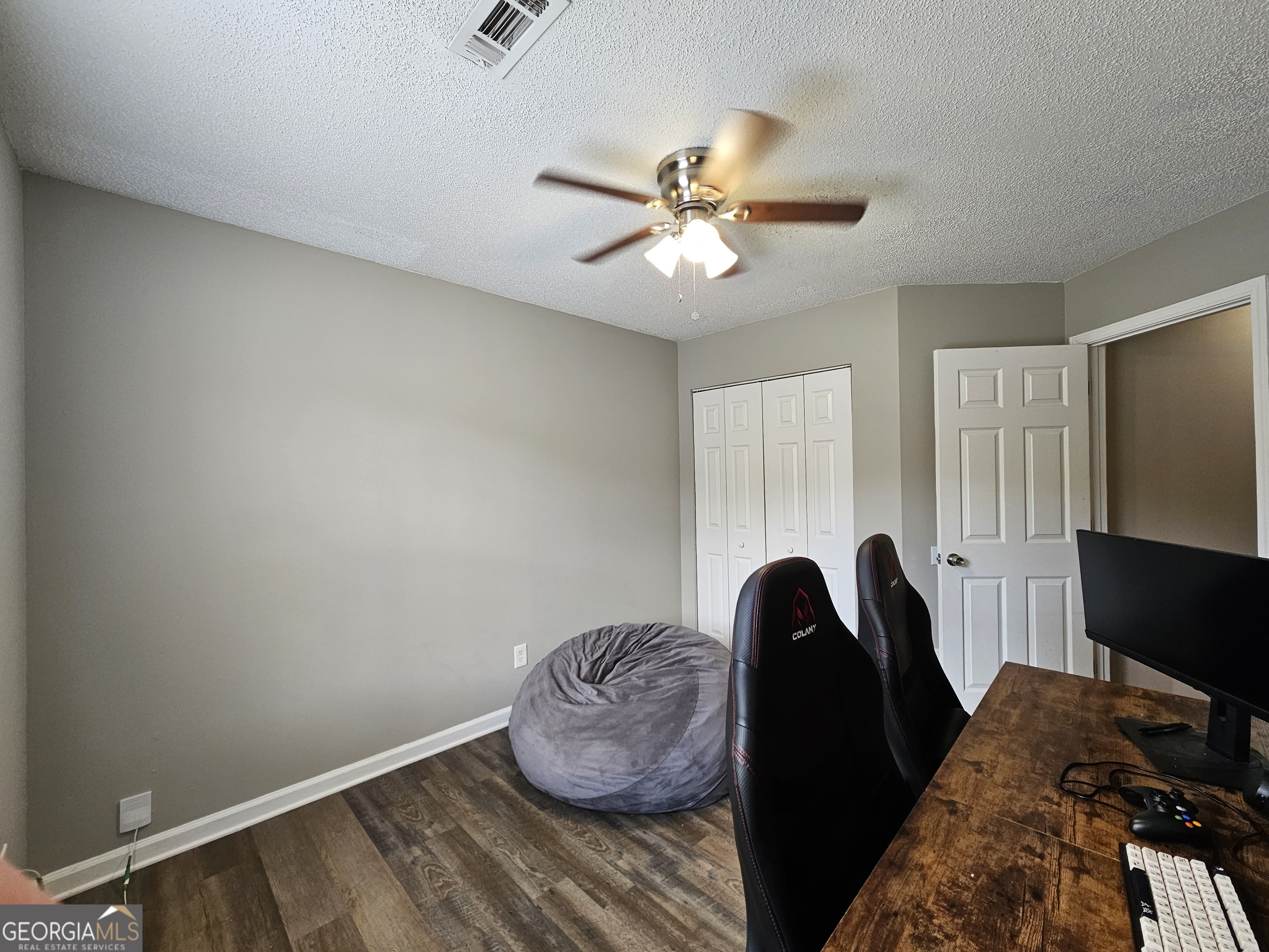 5077 Meadow Trace Fairburn, GA 30213 - Photo 34 of 43 a room with a bed and a window