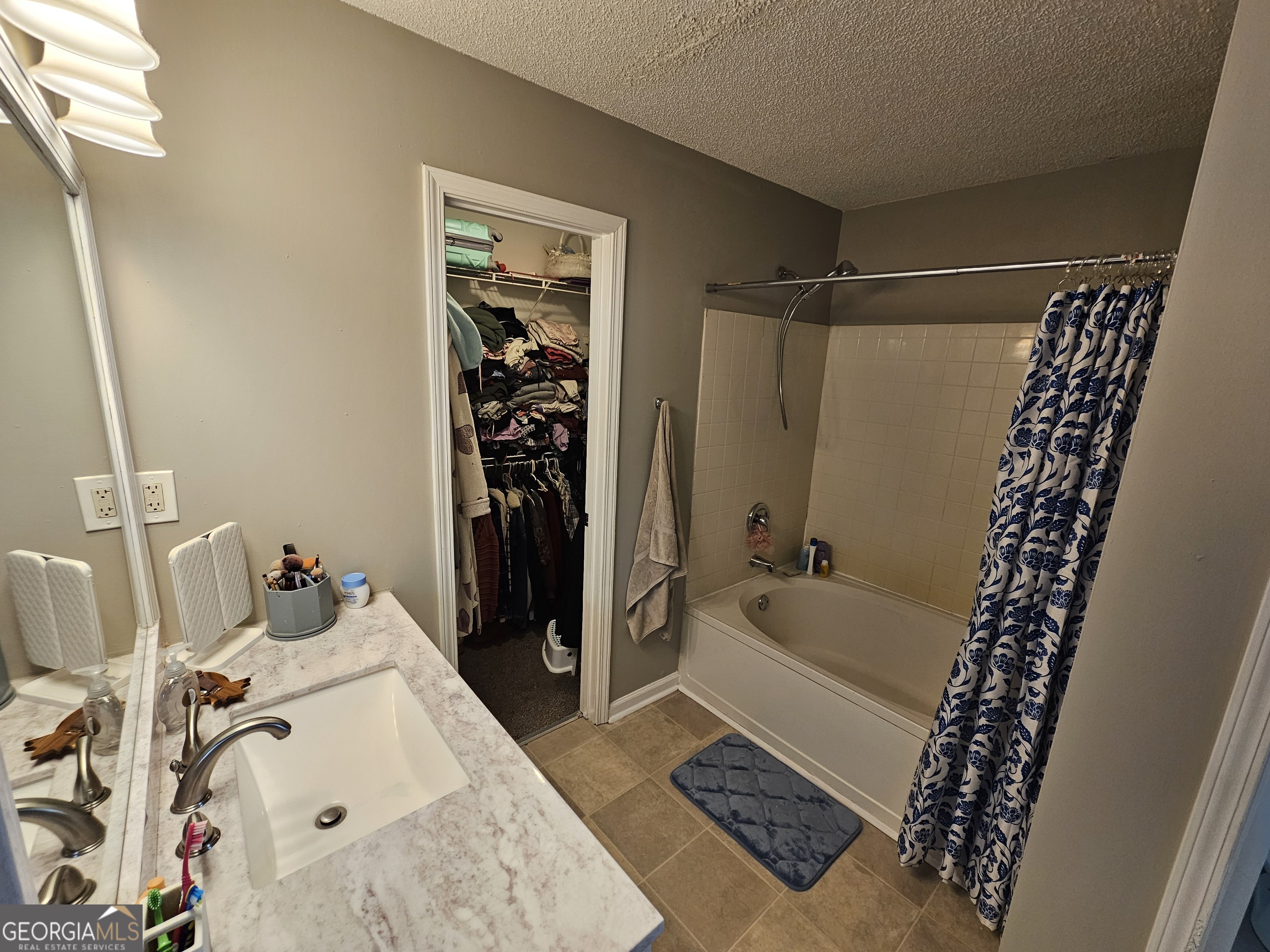 5077 Meadow Trace Fairburn, GA 30213 - Photo 39 of 43 a bathroom with a bathtub and shower