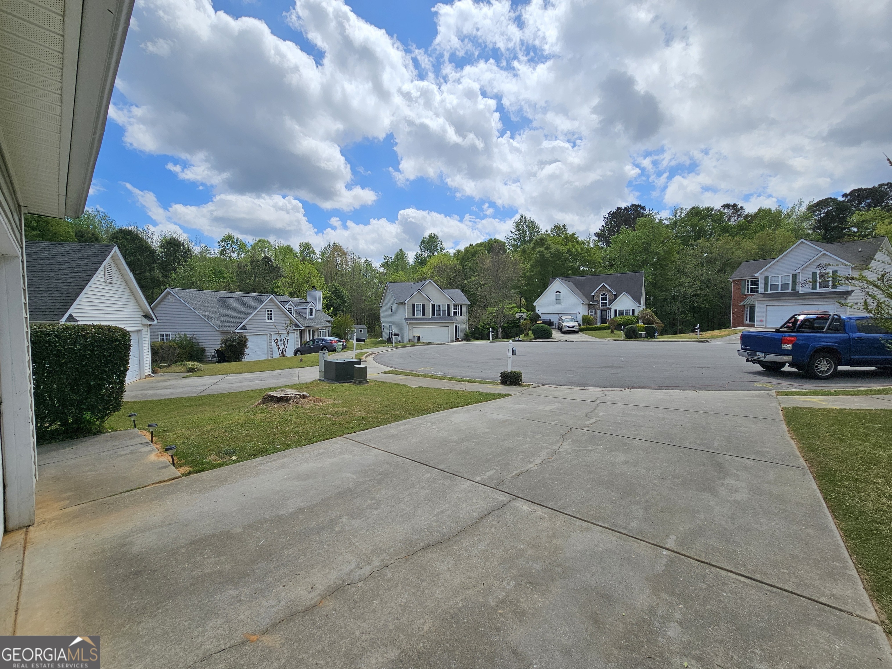 5077 Meadow Trace Fairburn, GA 30213 - Photo 6 of 43 a view of street with parked cars