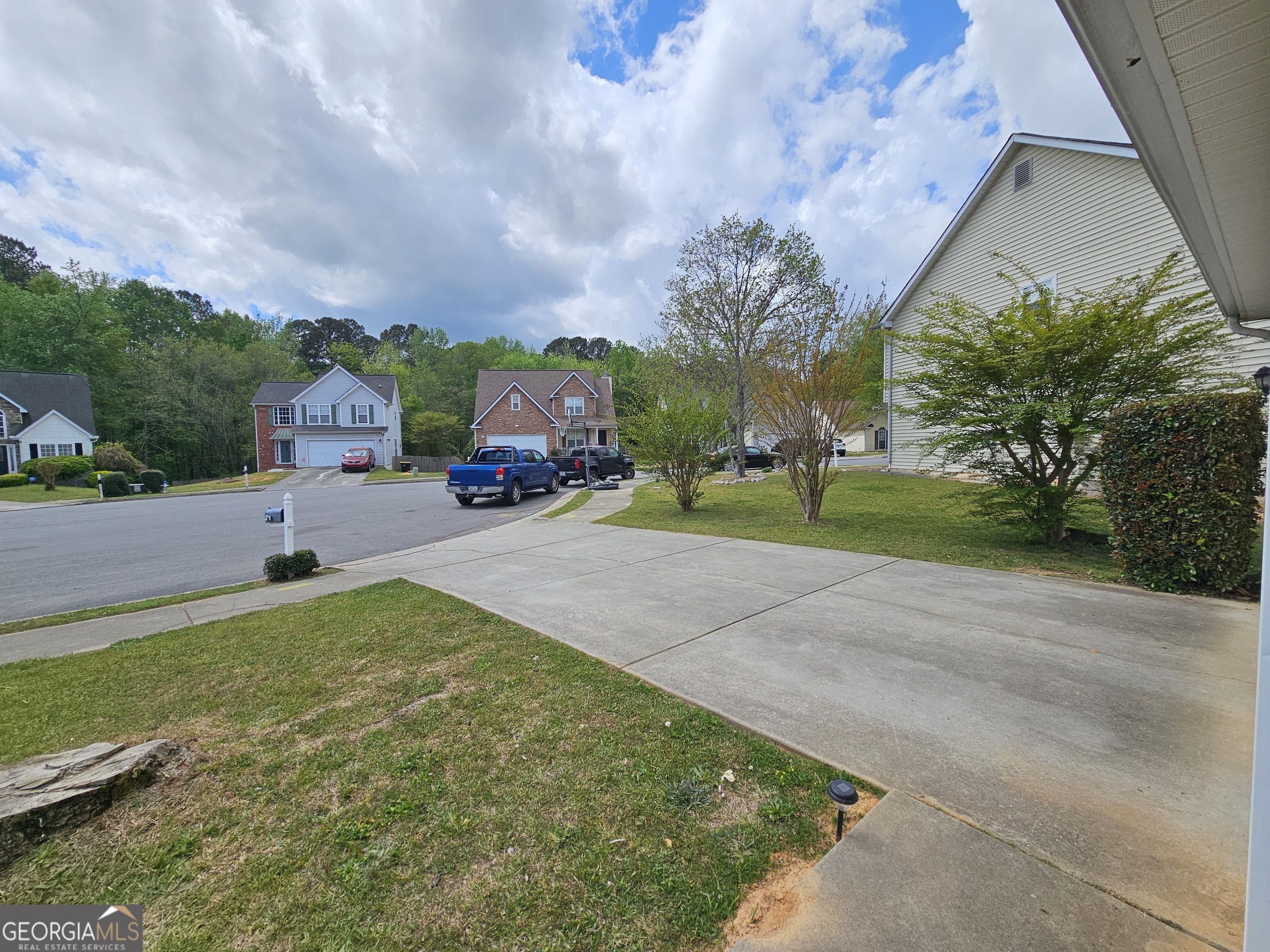 5077 Meadow Trace Fairburn, GA 30213 - Photo 7 of 43 an aerial view of a house with a yard and large trees