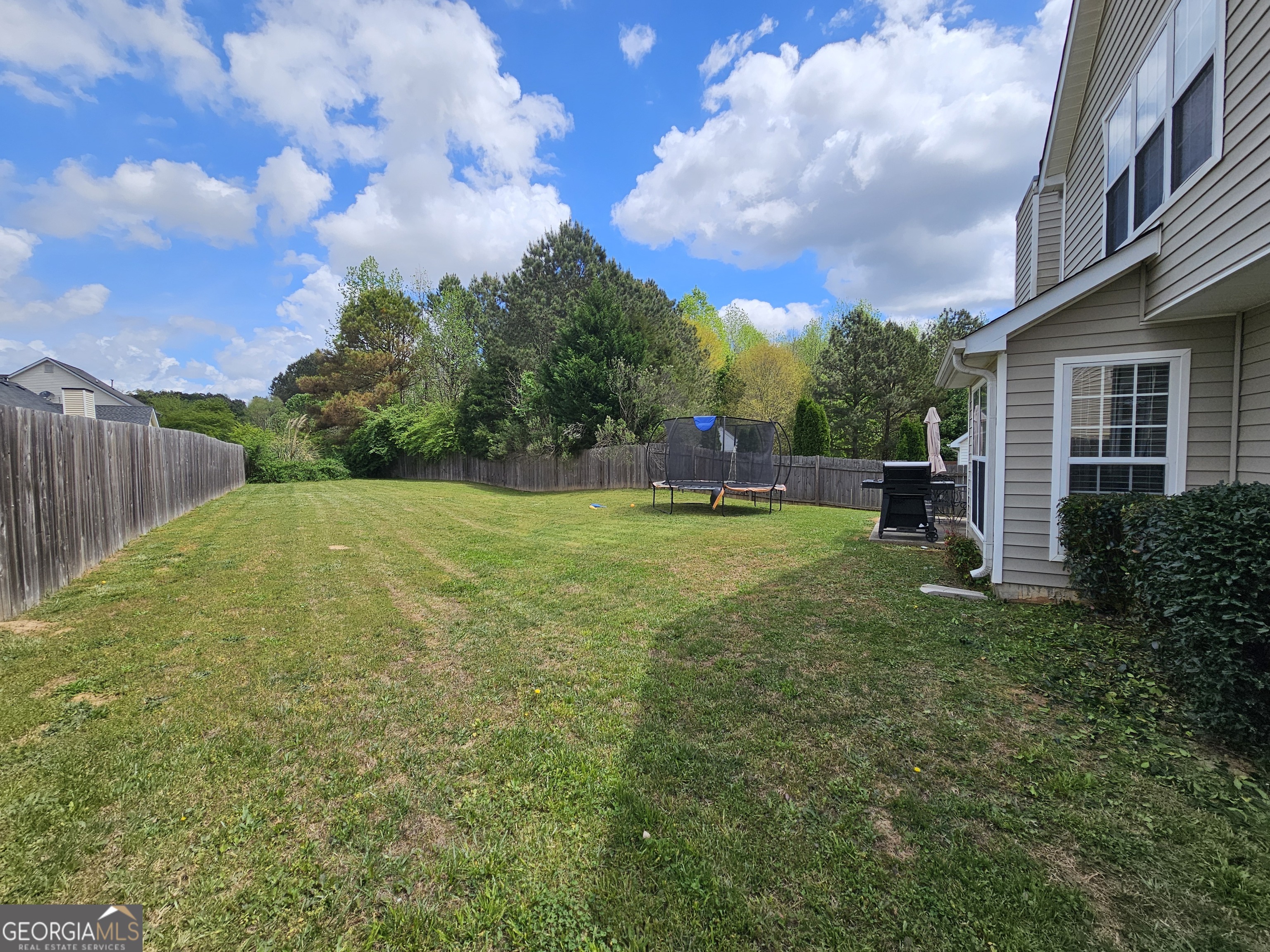 5077 Meadow Trace Fairburn, GA 30213 - Photo 10 of 43 a view of a backyard
