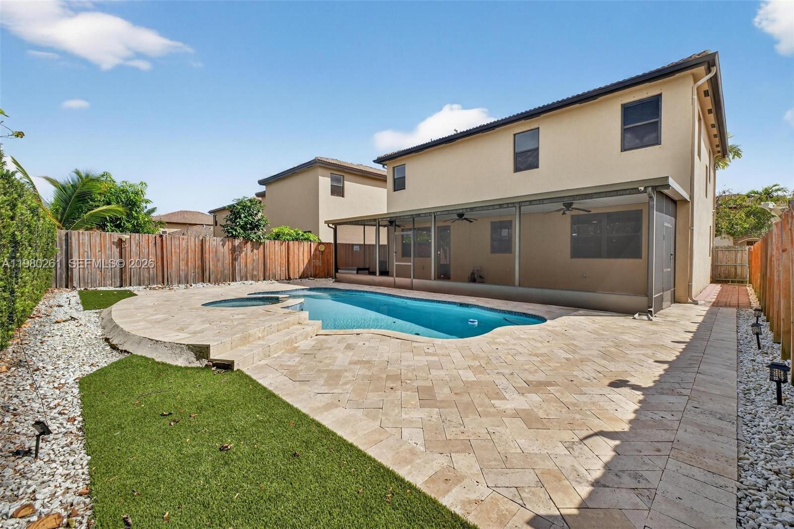 11561 Southwest 232nd Lane Homestead, FL 33032 - Photo 25 of 60 a view of a house with a yard