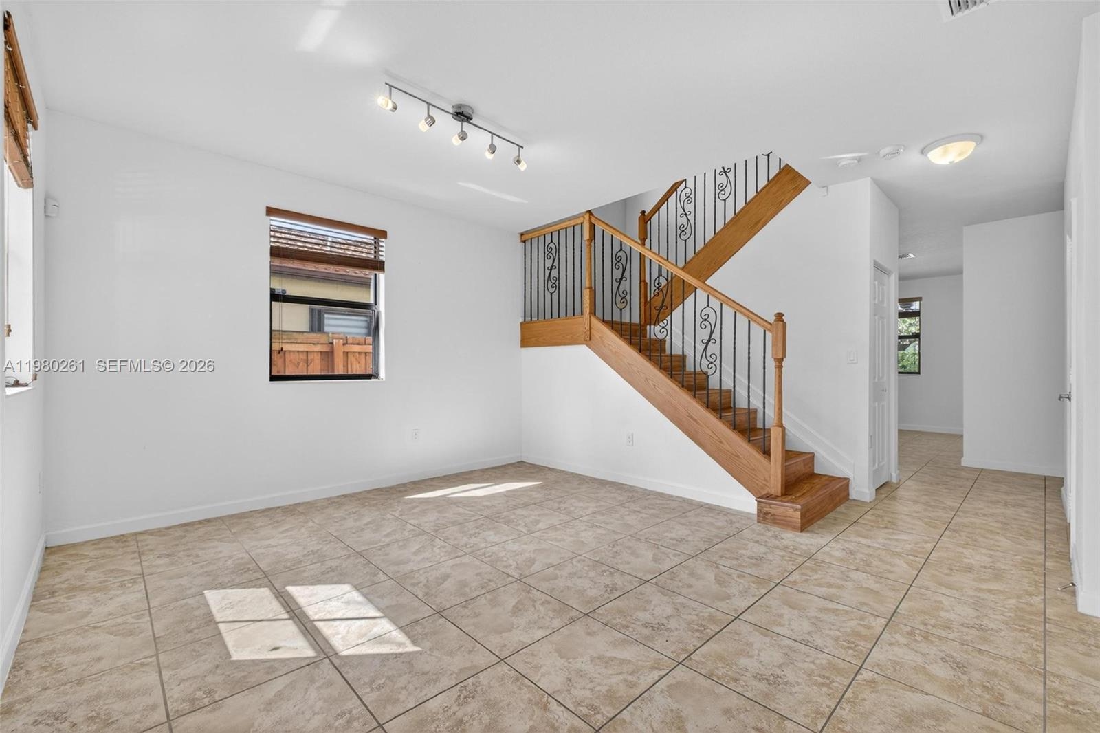 11561 Southwest 232nd Lane Homestead, FL 33032 - Photo 4 of 60 a view of entryway and hall with a window