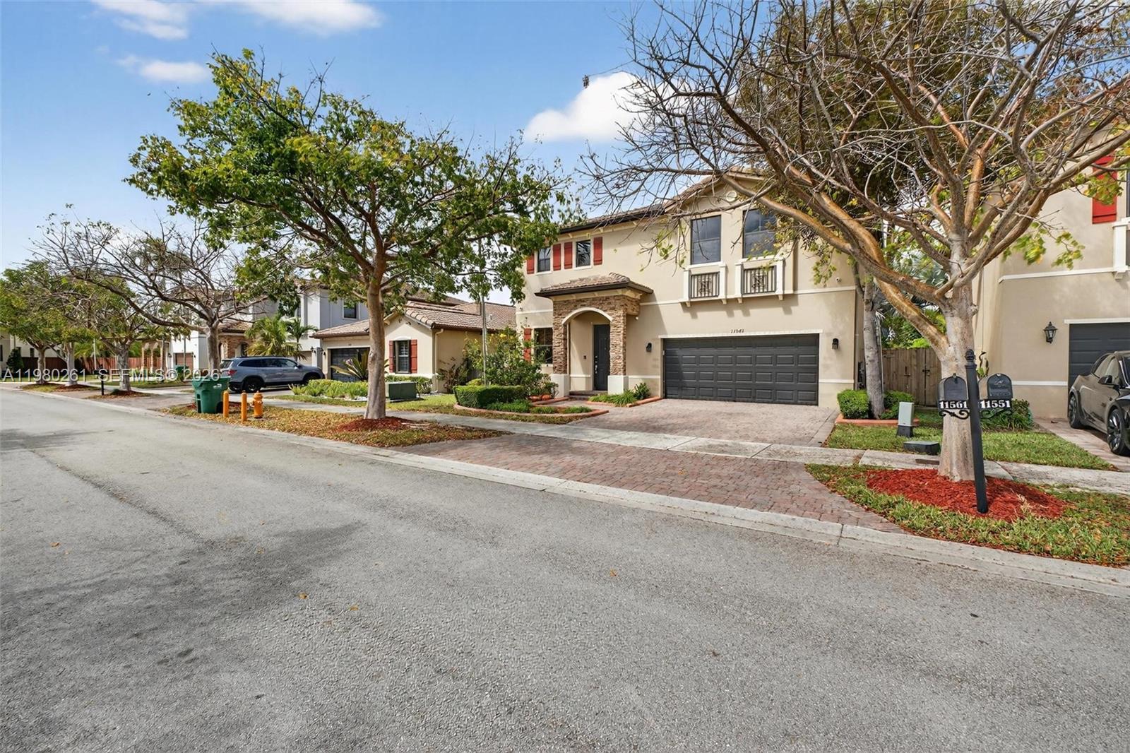 11561 Southwest 232nd Lane Homestead, FL 33032 - Photo 59 of 60 a front view of a building with street view