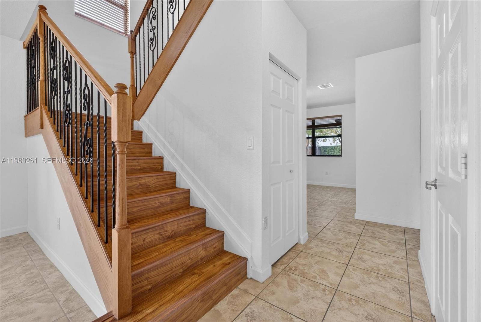 11561 Southwest 232nd Lane Homestead, FL 33032 - Photo 7 of 60 a view of entryway and hall with wooden floor
